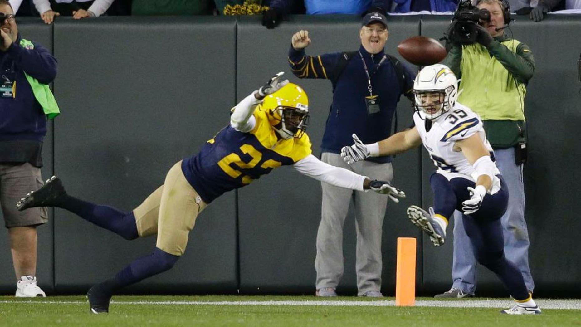 The Green Bay Packers' Damarious Randall (left) deflects a pass intended for the San Diego Chargers' Danny Woodhead on the final play of an NFL game, Sunday, Oct. 18, 2015, in Green Bay, Wis. The Packers won 27-20.