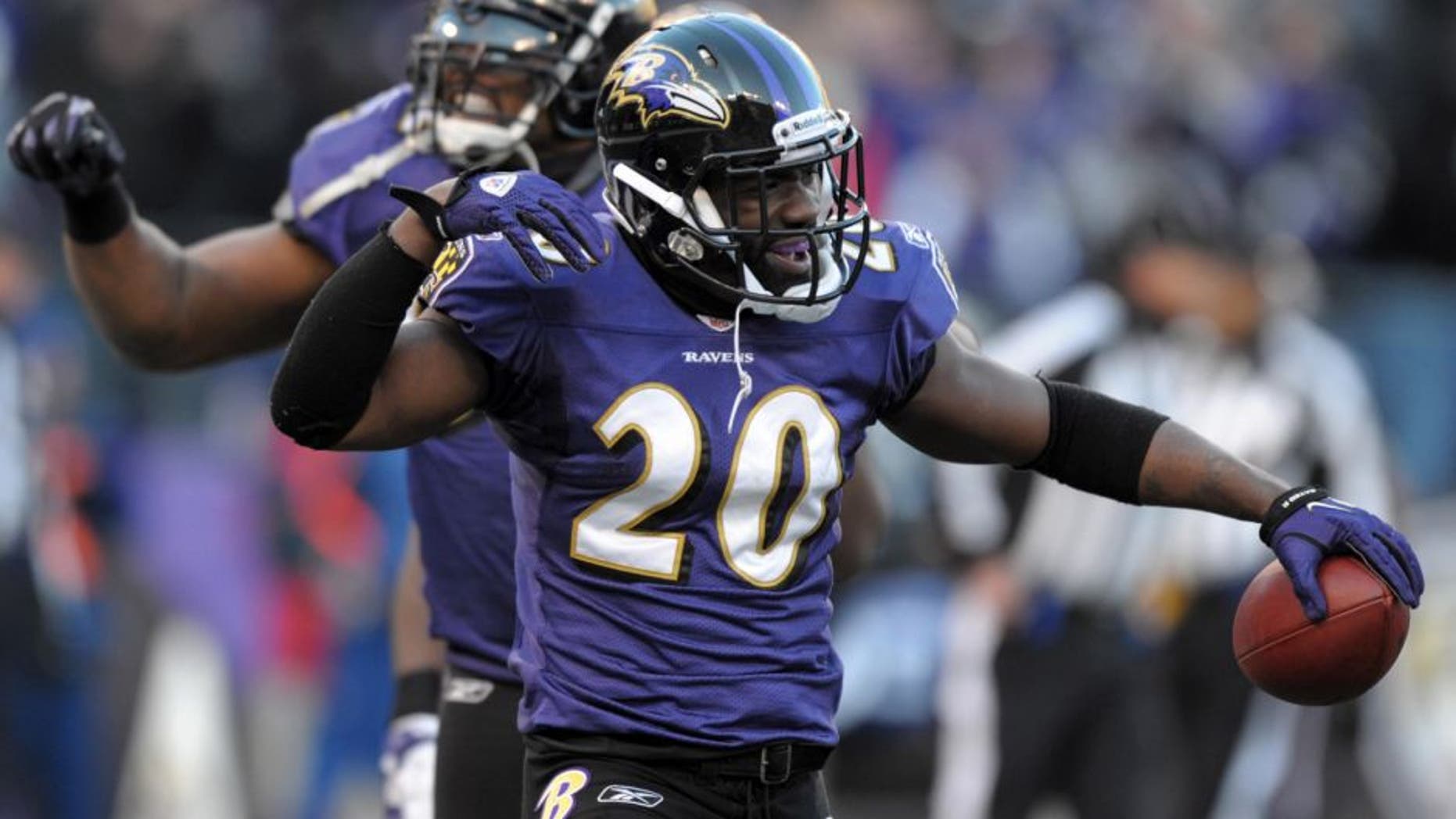 Jan 15, 2012; Baltimore, MD, USA; Baltimore Ravens safety Ed Reed (20) and linebacker Terrell Suggs (55) react after an interception by Reed in the fourth quarter in the AFC Divisional Playoff game against the Houston Texans at M&T Bank Stadium. The Ravens defeated the Texans 20-13. Mandatory Credit: Kirby Lee/Image of Sport-USA TODAY Sports