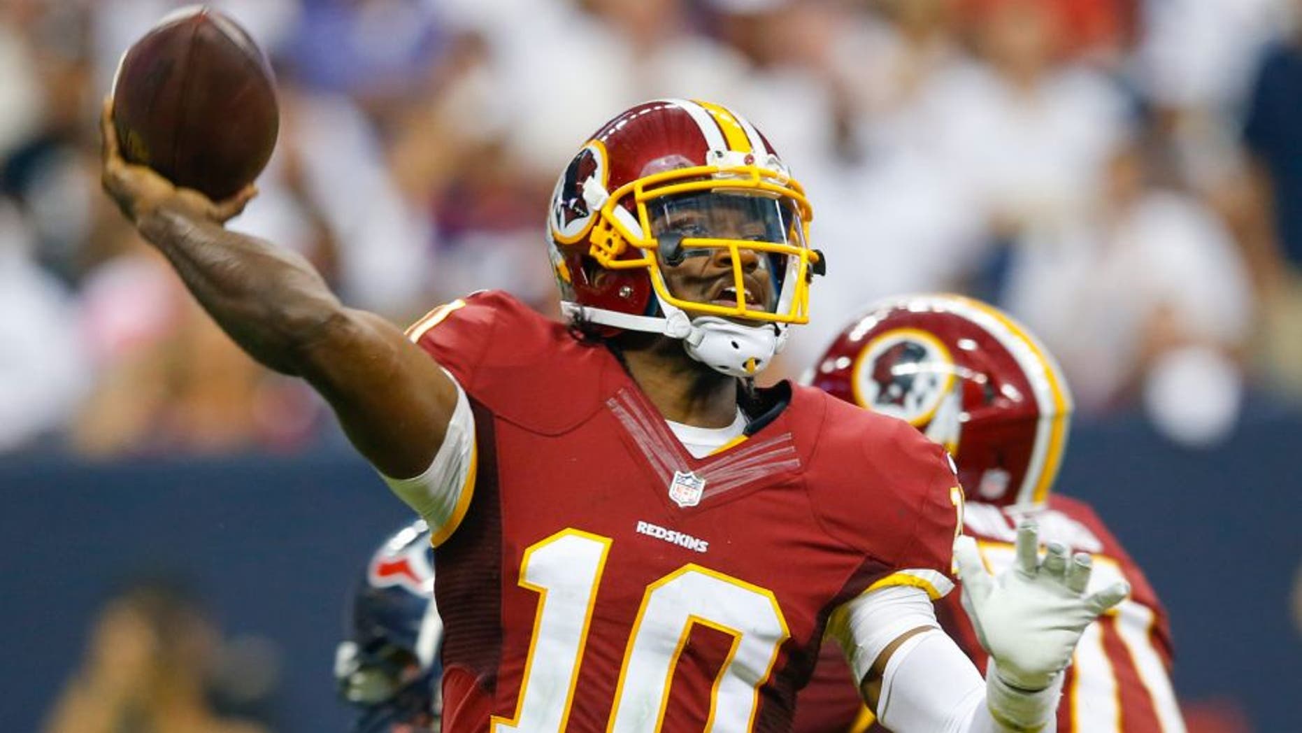 Sep 7, 2014; Houston, TX, USA; Washington Redskins quarterback Robert Griffin III (10) throws during the game against the Houston Texans at NRG Stadium. Mandatory Credit: Kevin Jairaj-USA TODAY Sports