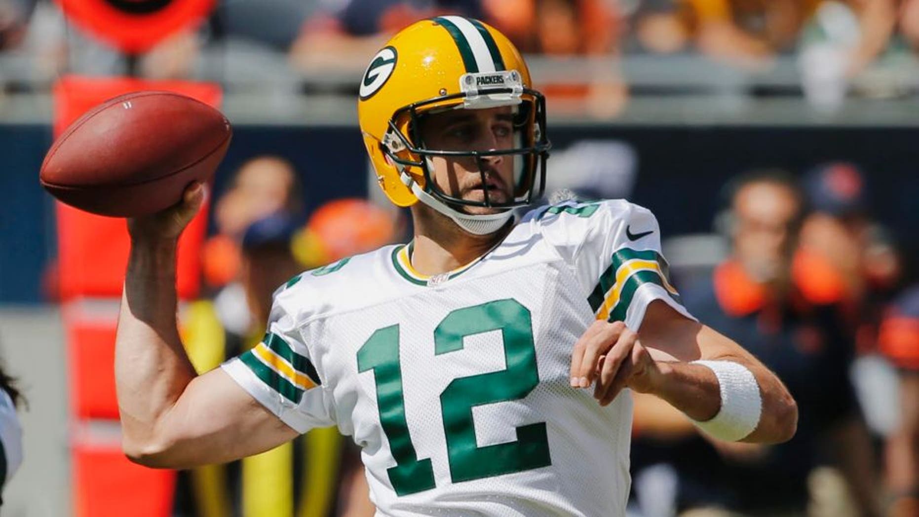 Green Bay Packers quarterback Aaron Rodgers throws a pass during the first half an NFL football game against the Chicago Bears, Sunday, Sept. 13, 2015, in Chicago.