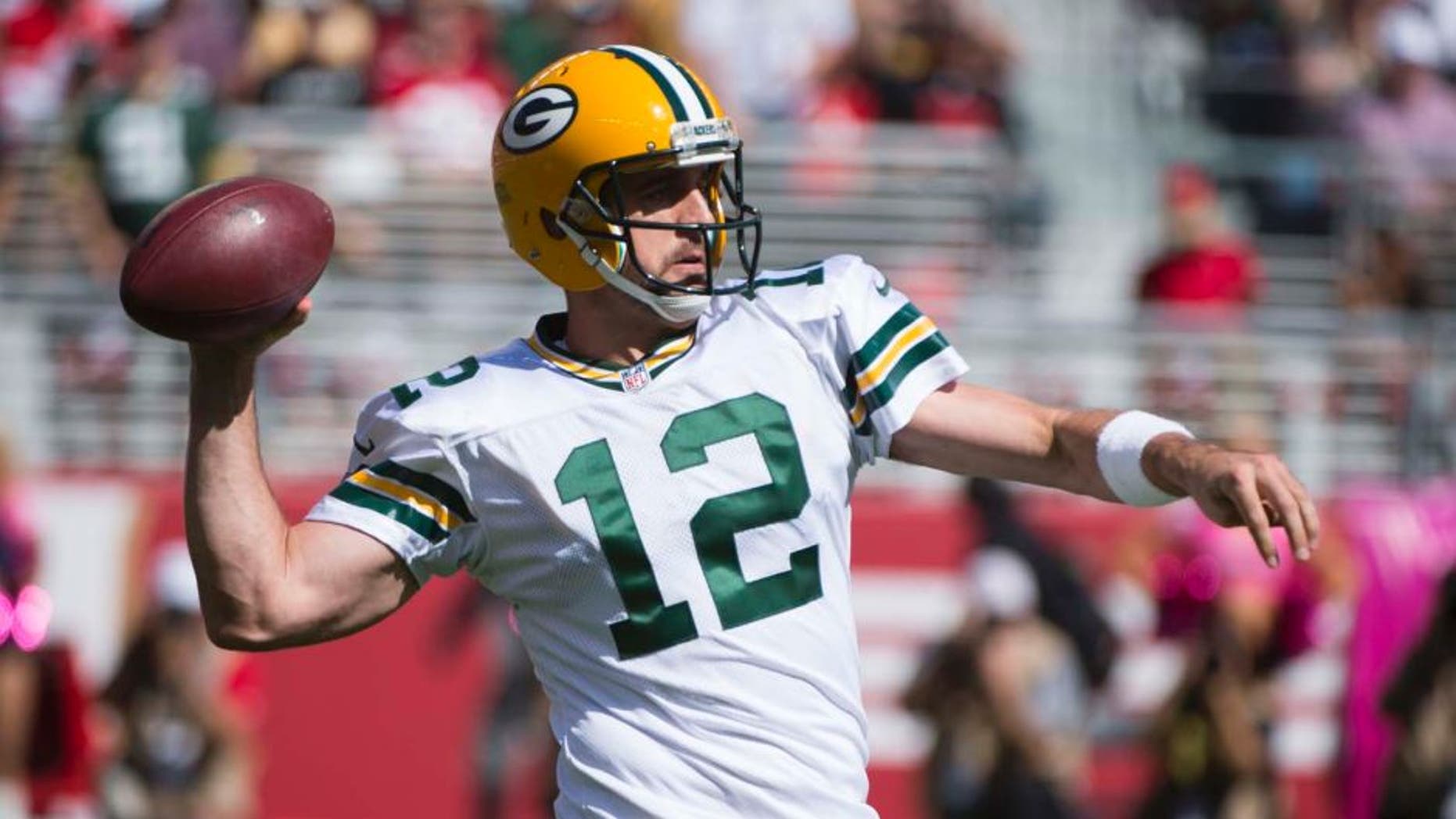 Green Bay Packers quarterback Aaron Rodgers passes the football against the San Francisco 49ers during the first quarter at Levi's Stadium in Santa Clara, Calif., on Sunday, Oct. 4, 2015.