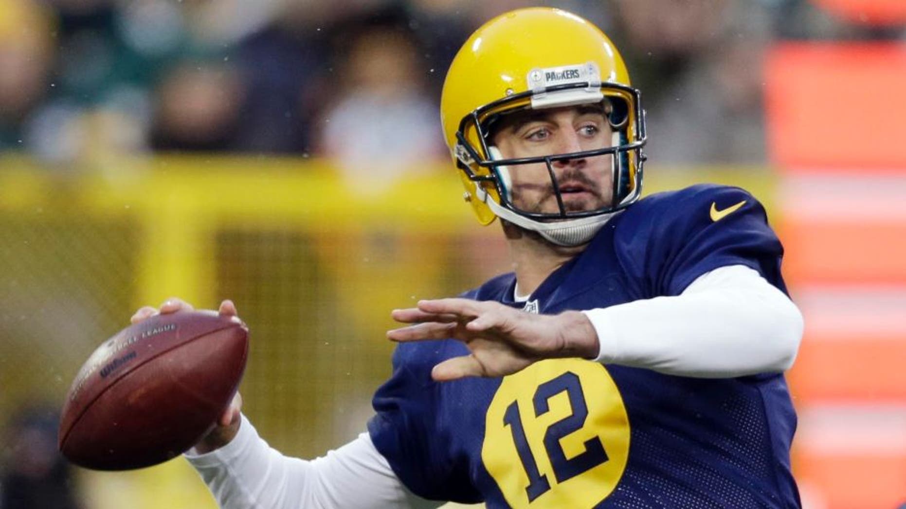 The Green Bay Packers' Aaron Rodgers throws during the first half against the Philadelphia Eagles in Green Bay, Wis.
