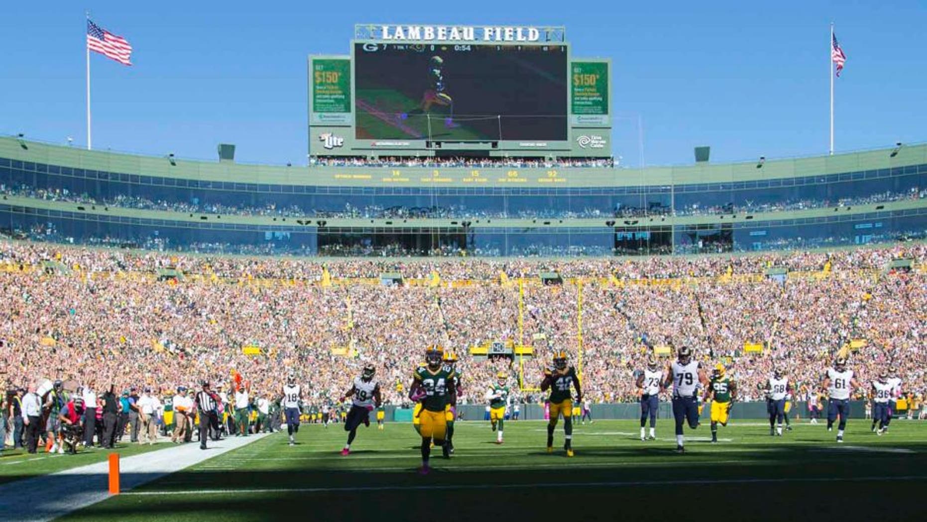 Green Bay Packers cornerback Quinten Rollins returns an interception for a touchdown in the first quarter against the St. Louis Rams at Lambeau Field in Green Bay, Wis., on Sunday, Oct. 11, 2015.