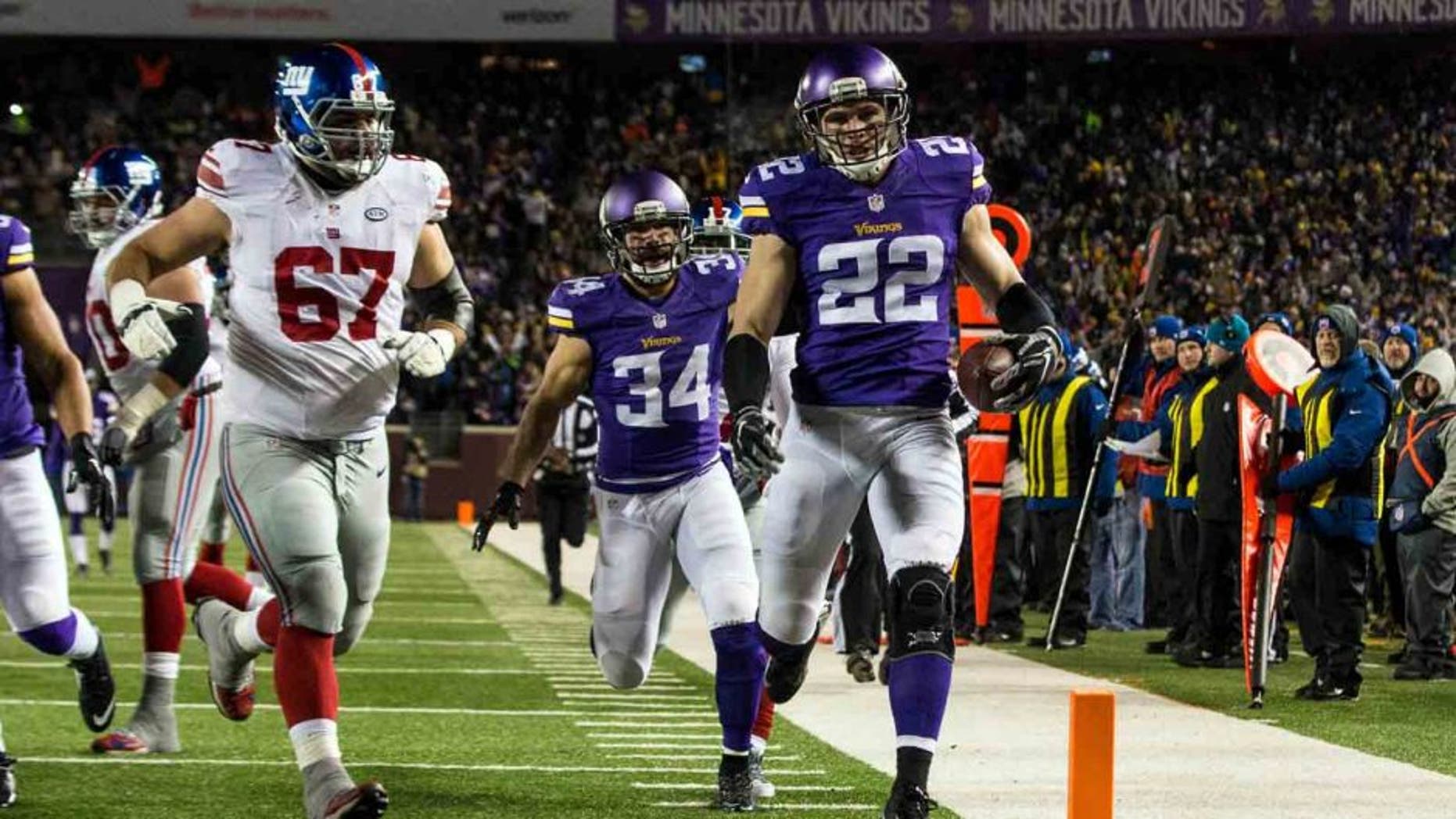 Minnesota Vikings safety Harrison Smith returns an interception for a touchdown during the second quarter against the New York Giants at TCF Bank Stadium in Minneapolis on Sunday, Dec. 27, 2015.