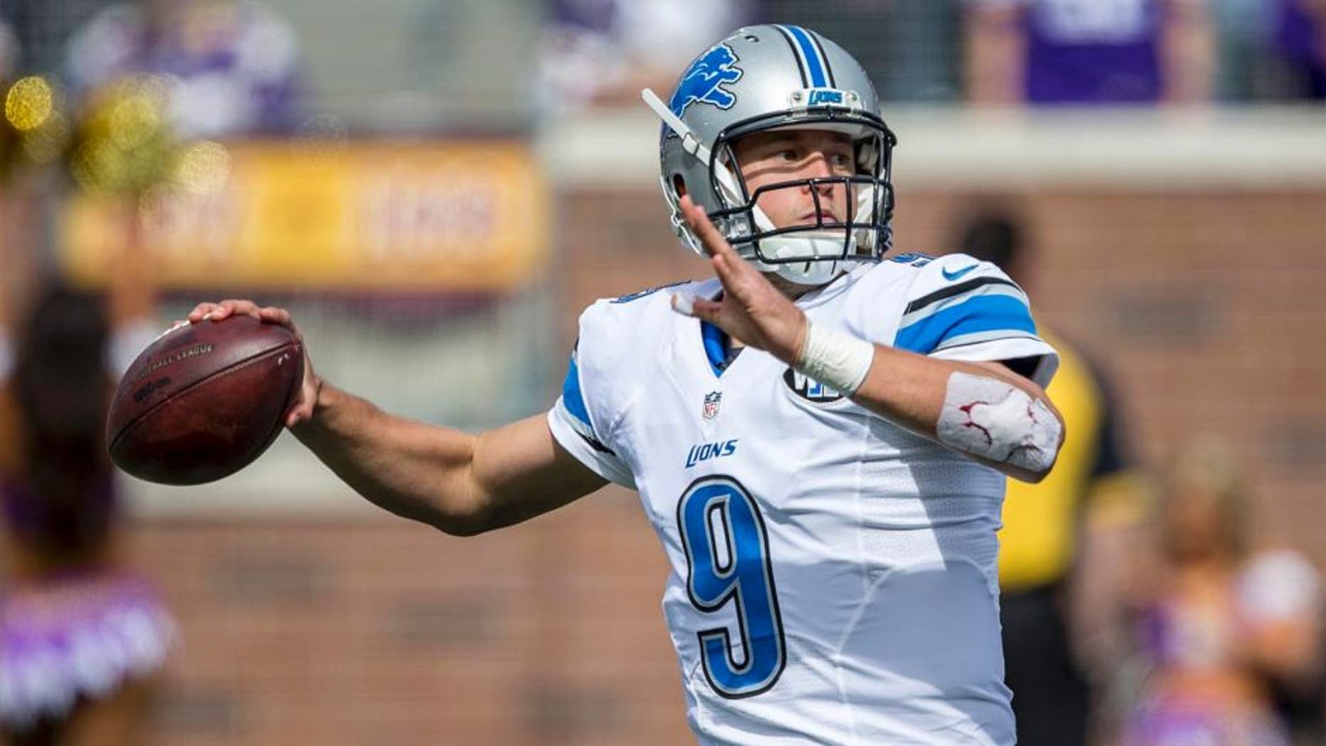 Detroit Lions quarterback Matthew Stafford drops back for a pass in the first half against the Minnesota Vikings at TCF Bank Stadium in Minneapolis on Sunday, Sept. 20, 2015.