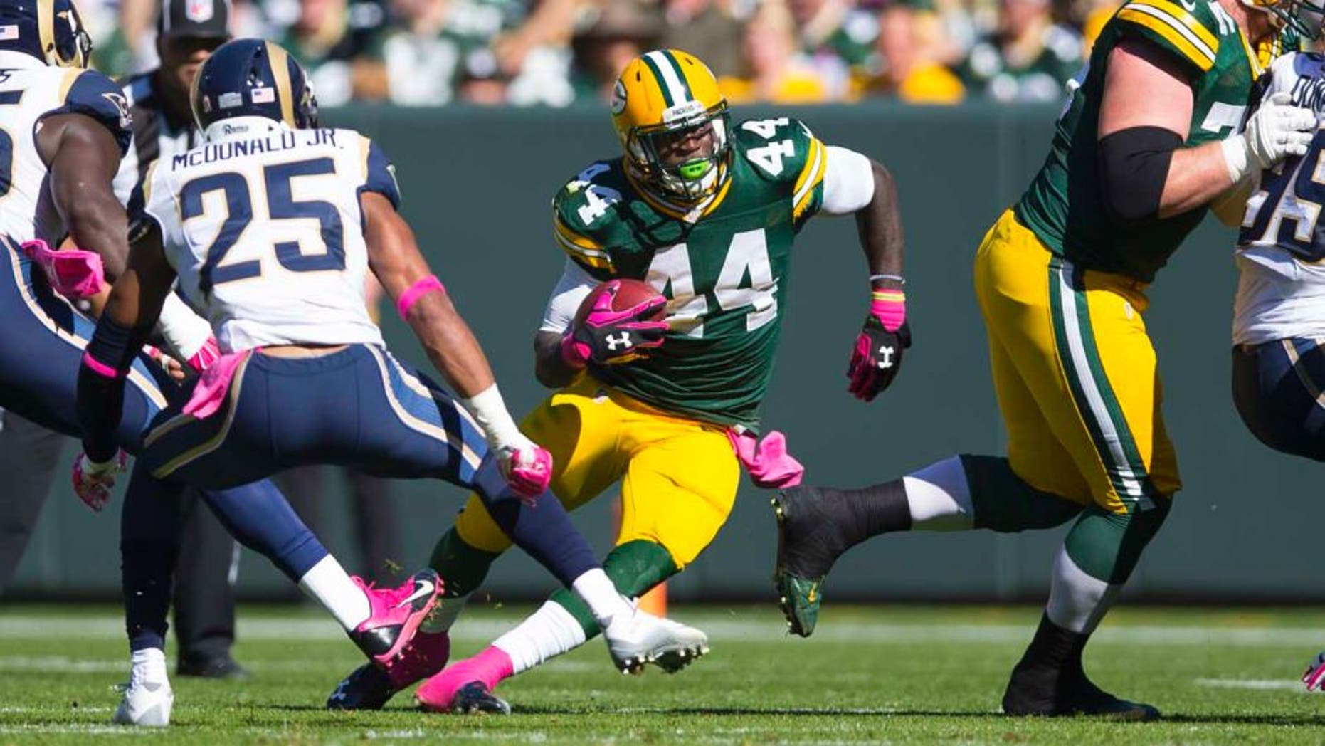 Green Bay Packers running back James Starks rushes with the football during the first quarter against the St. Louis Rams at Lambeau Field in Green Bay, Wis., on Sunday, Oct. 11, 2015.
