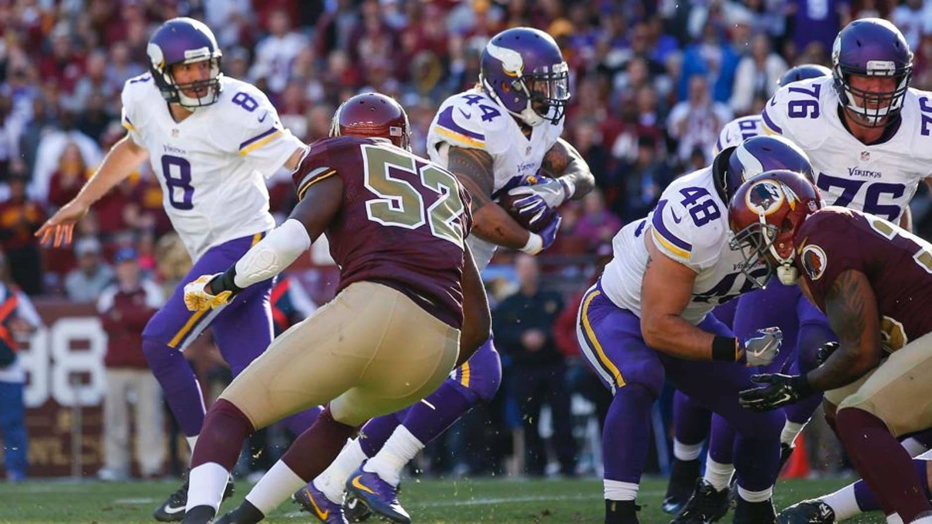Minnesota Vikings running back Matt Asiata (44) carries the ball past Washington Redskins linebacker Terence Garvin (52) for a touchdown during the first half of an NFL football game in Landover, Md., Sunday, Nov. 13, 2016. (AP Photo/Alex Brandon)