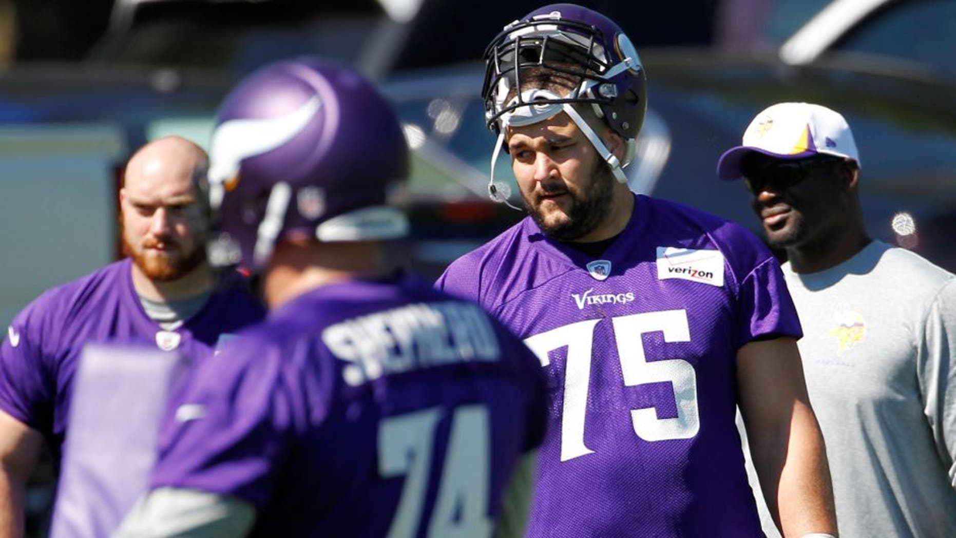 Minnesota Vikings tackle Matt Kalil (75) listens to a coach during NFL football minicamp in Eden Prairie, Minn., Tuesday, June 16, 2015. (AP Photo/Ann Heisenfelt)