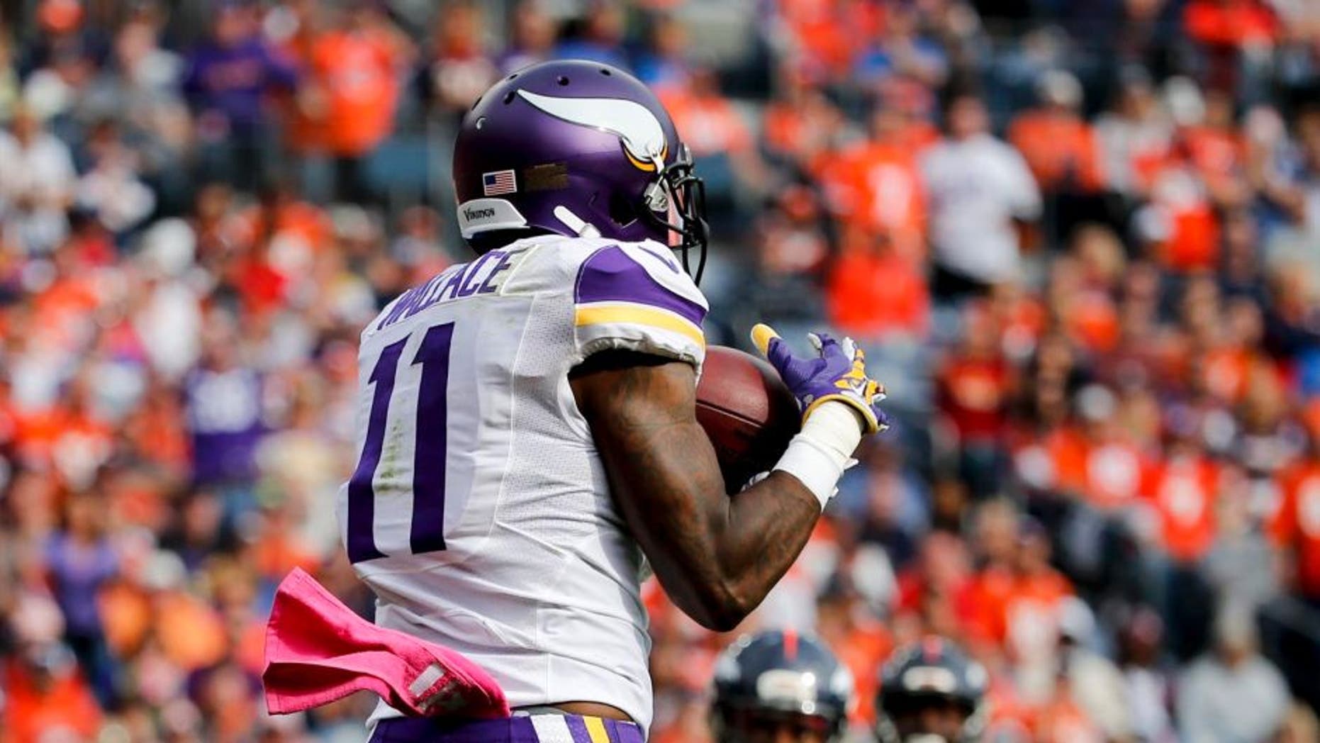 Minnesota Vikings wide receiver Mike Wallace catches a touchdown pass during the first half against the Denver Broncos on Sunday, Oct. 4, 2015, in Denver.