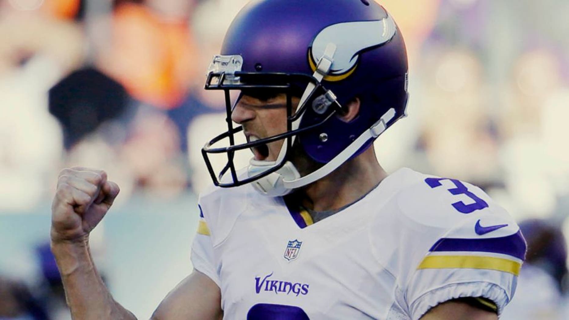 Minnesota Vikings kicker Blair Walsh pumps his fist after kicking the game-winning field goal against the Chicago Bears during the second half of an NFL football game Sunday, Nov. 1, 2015, in Chicago. The Vikings won 23-20.