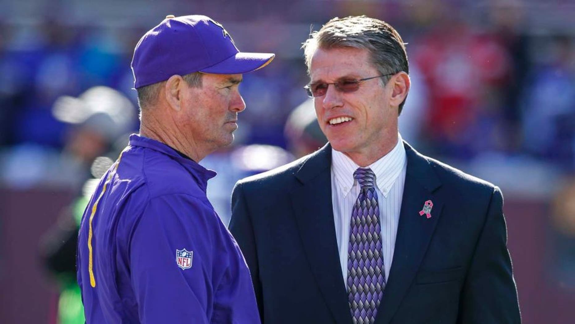 Minnesota Vikings head coach Mike Zimmer (left) speaks with general manager Rick Spielman prior to their game against the Kansas City Chiefs at TCF Bank Stadium in Minneapolis on Sunday, Oct. 18, 2015.