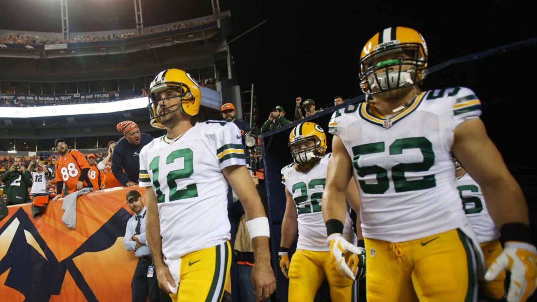 Green Bay Packers quarterback Aaron Rodgers (left) and inside linebacker Clay Matthews exit the tunnel before the game against the Denver Broncos at Sports Authority Field at Mile High in Denver on Sunday, Nov. 1, 2015.