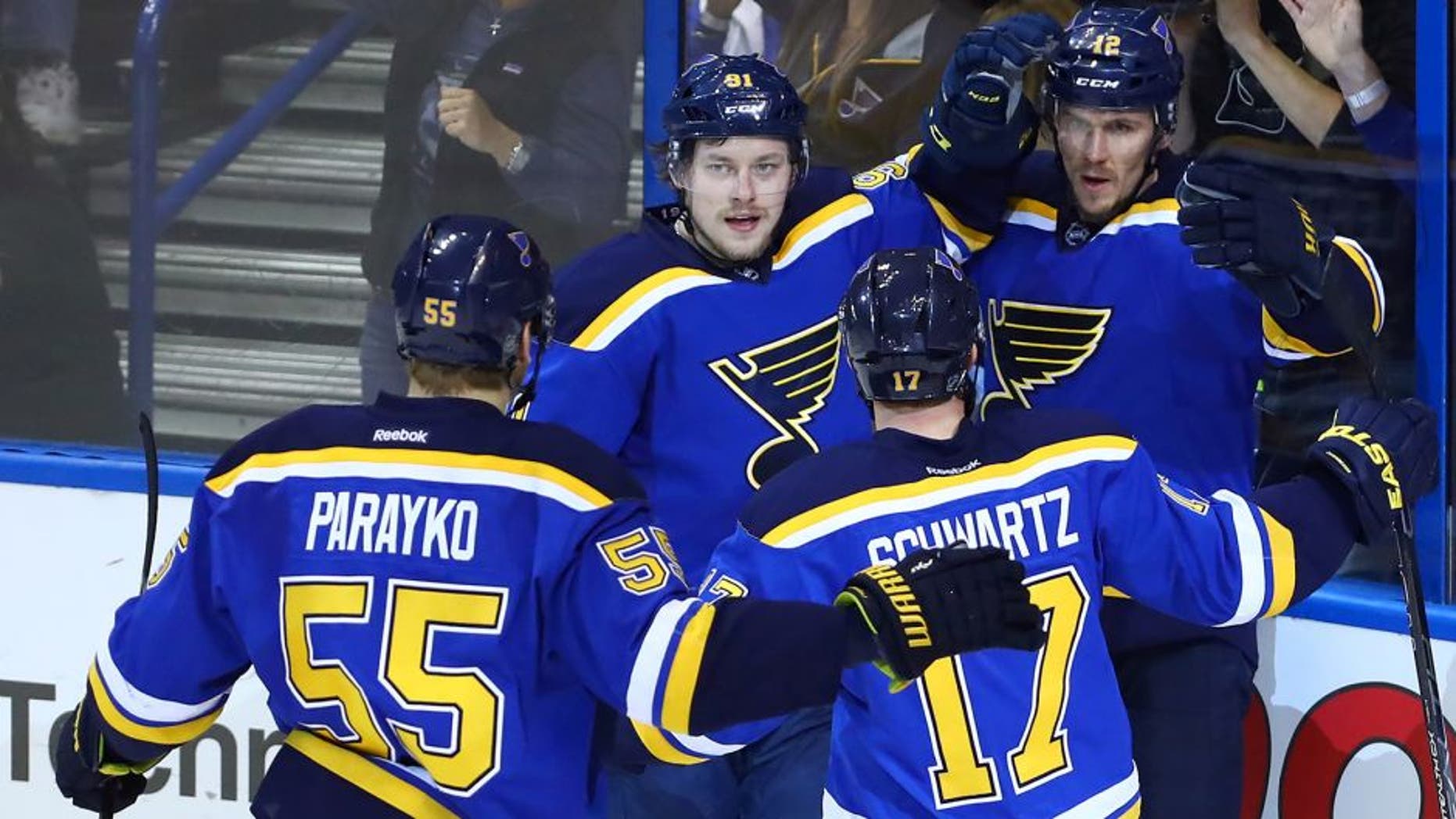 May 15, 2016; St. Louis, MO, USA; St. Louis Blues center Jori Lehtera (12) is congratulated by right wing Vladimir Tarasenko (91) and left wing Jaden Schwartz (17) and defenseman Colton Parayko (55) after scoring a goal against San Jose Sharks goalie Martin Jones (not pictured) during the second period in game one of the Western Conference Final of the 2016 Stanley Cup Playoffs at Scottrade Center. Mandatory Credit: Billy Hurst-USA TODAY Sports
