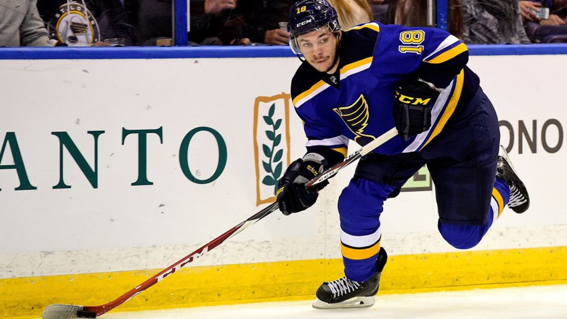 Apr 2, 2015; St. Louis, MO, USA; St. Louis Blues right wing Ty Rattie (18) controls the puck against the Calgary Flames during the second period at Scottrade Center. Mandatory Credit: Jasen Vinlove-USA TODAY Sports