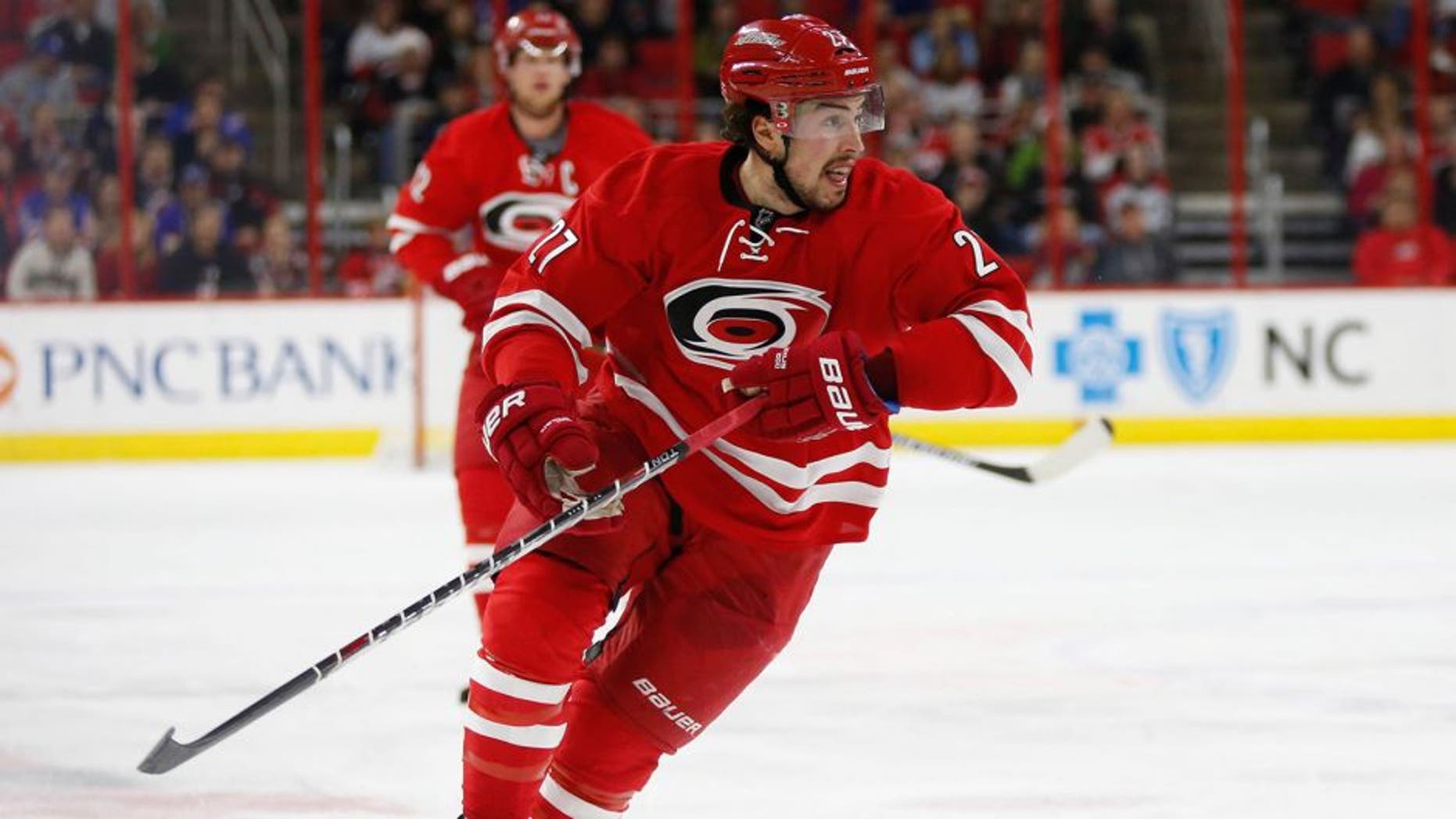 Dec 20, 2014; Raleigh, NC, USA; Carolina Hurricanes defensemen Justin Faulk (27) skates against the New York Rangers at PNC Arena. The New York Rangers defeated the Carolina Hurricanes 3-2 in the shoot out. Mandatory Credit: James Guillory-USA TODAY Sports