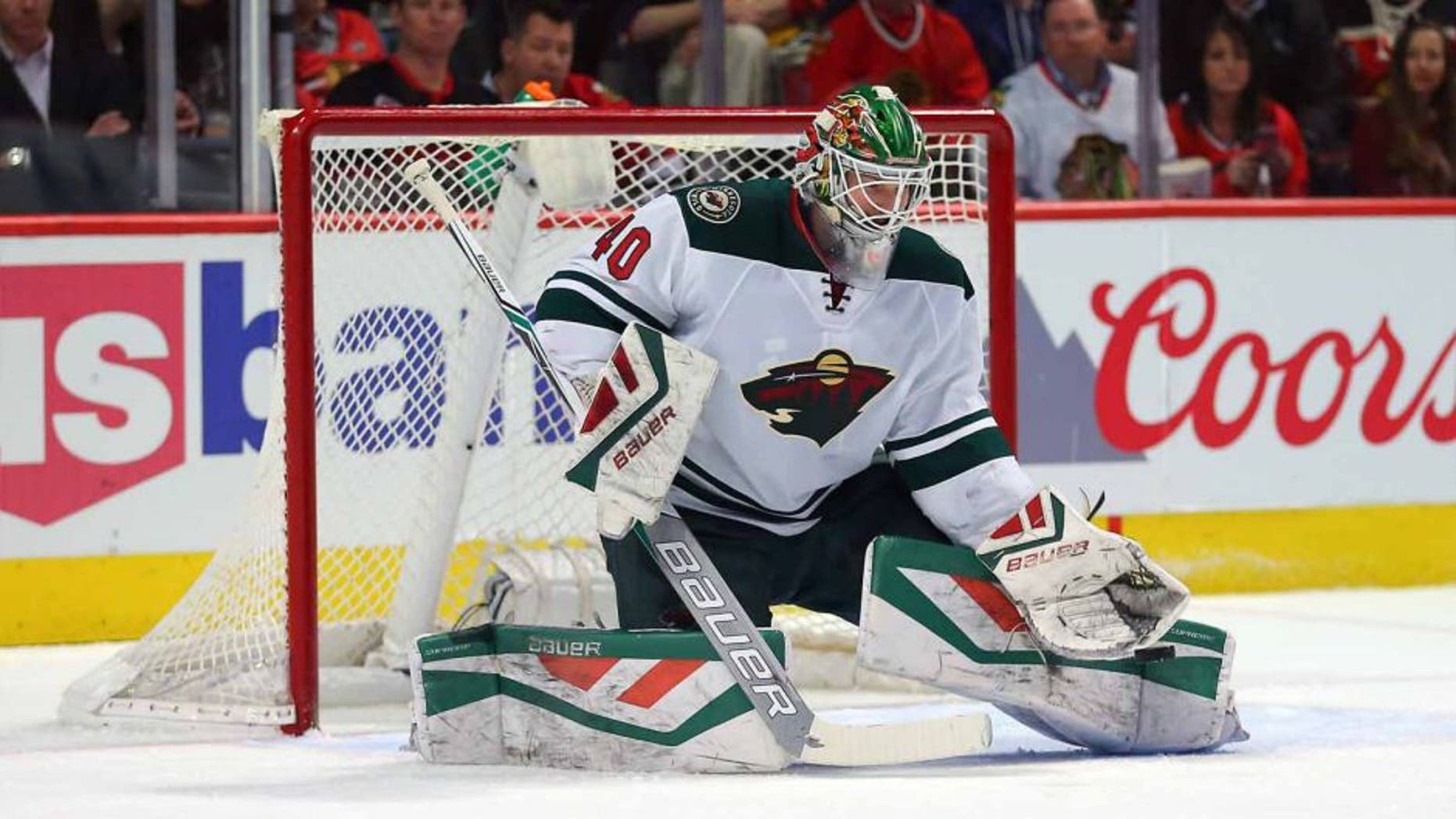 Minnesota Wild goalie Devan Dubnyk makes a save against the Chicago Blackhawks at the United Center in Chicago on March 20, 2016.