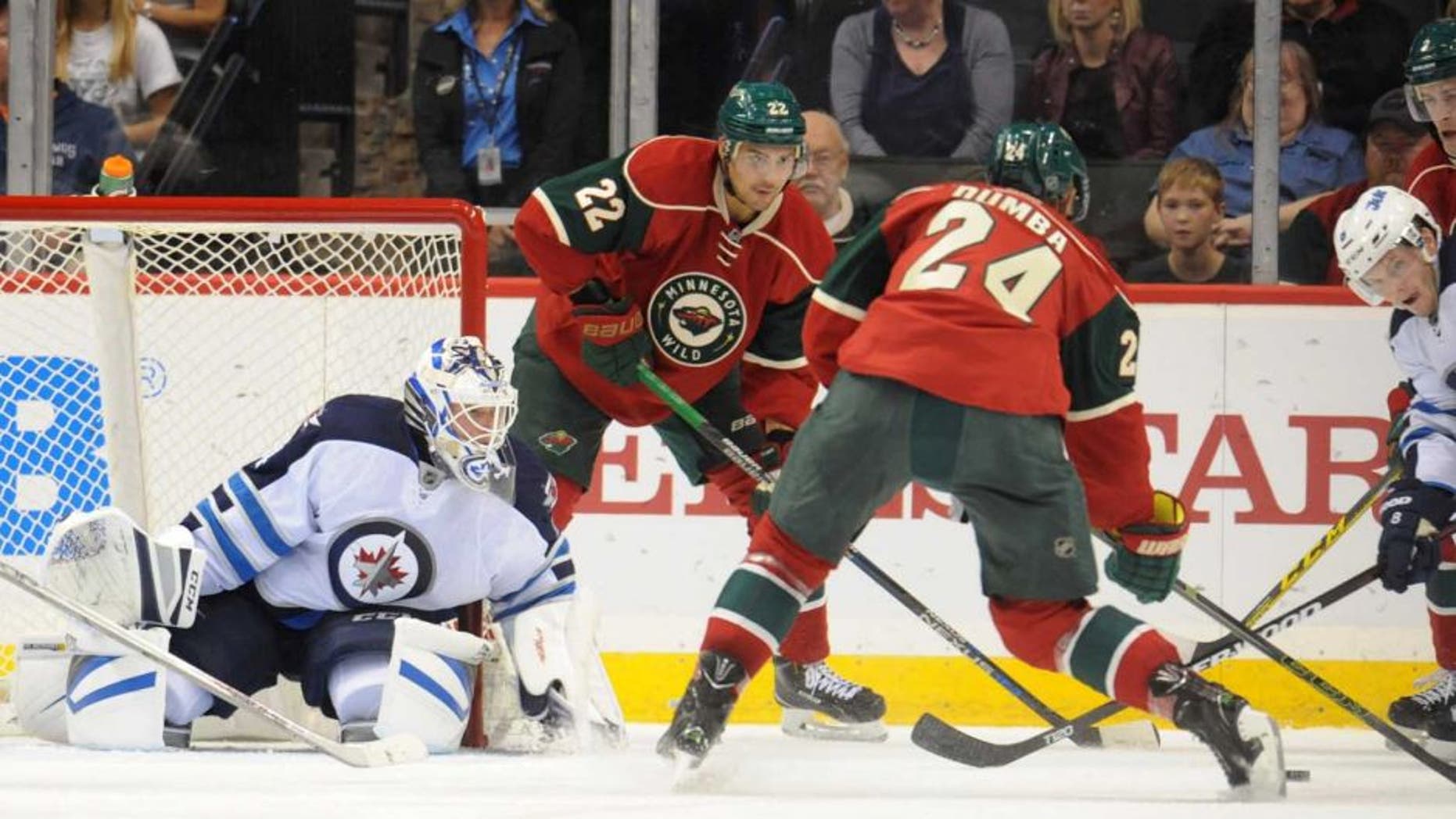 Minnesota Wild defenseman Matt Dumba shoots and scores on Winnipeg Jets goalie Michael Hutchinson during the first period of a preseason game at Xcel Energy Center in St. Paul, Minn., on Sunday, Sept. 27, 2015.