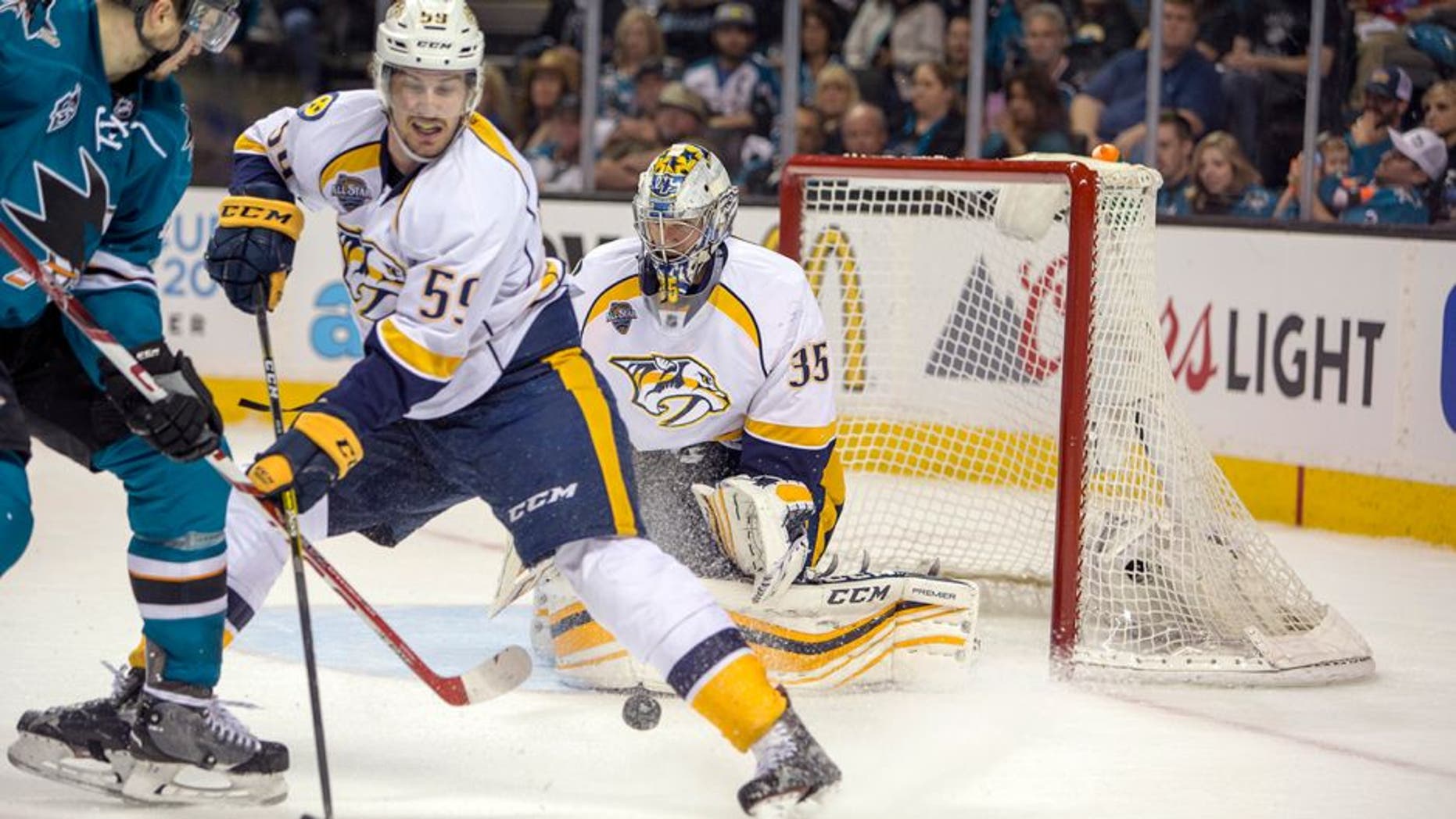 May 1, 2016; San Jose, CA, USA; San Jose Sharks center Tomas Hertl (48) attempts to shoot the puck against Nashville Predators goalie Pekka Rinne (35) while being defended by defenseman Roman Josi (59) in the third period in game two of the second round of the 2016 Stanley Cup Playoffs at SAP Center at San Jose. the San Jose Sharks defeat the Nashville Predators 3 to 2. Mandatory Credit: Neville E. Guard-USA TODAY Sports