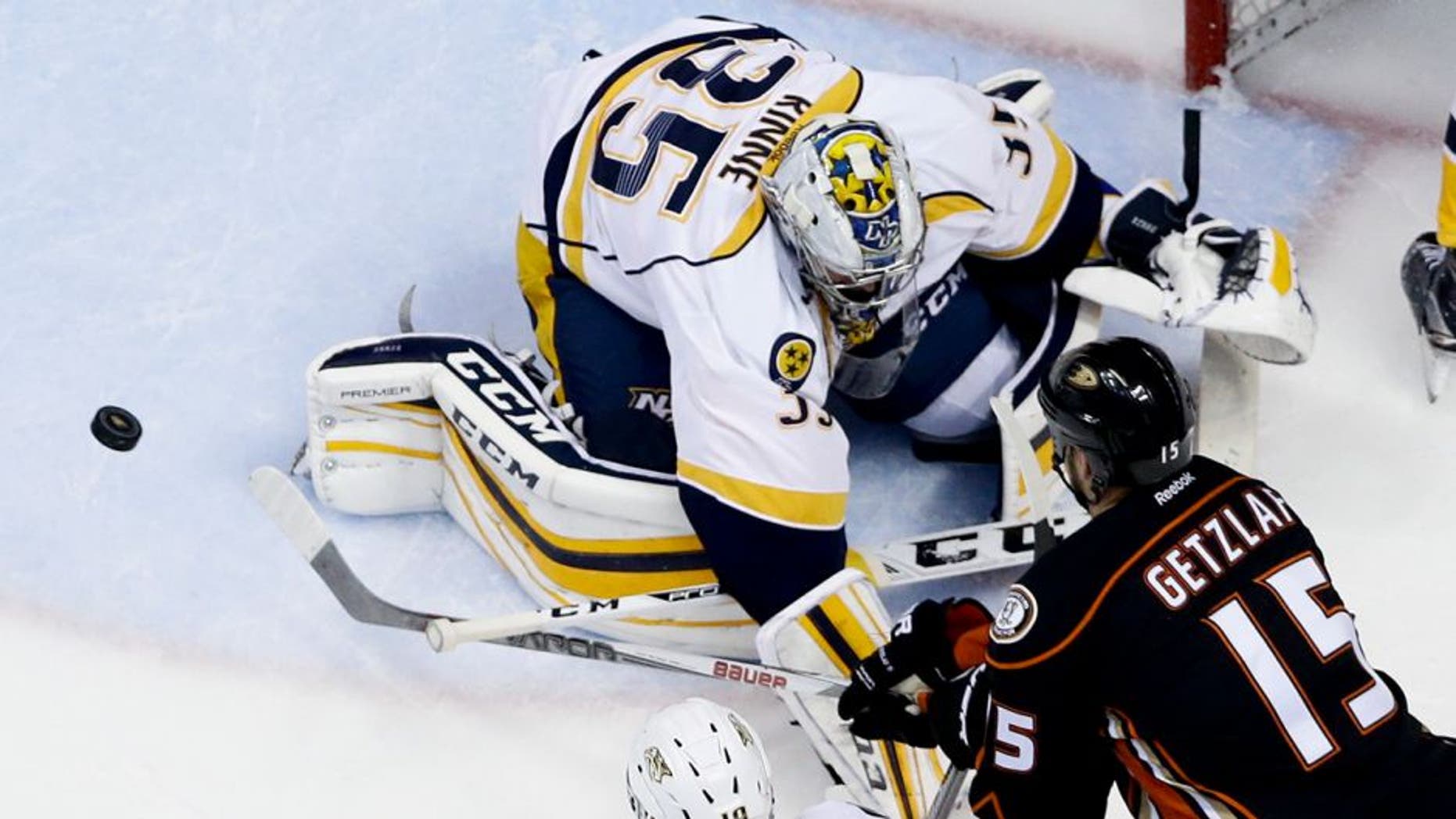 Nashville Predators goalie Pekka Rinne, left, blocks a shot by Anaheim Ducks center Ryan Getzlaf during the second period of Game 2 of an NHL hockey first-round Stanley Cup playoff series in Anaheim, Calif., Sunday, April 17, 2016. (AP Photo/Chris Carlson)