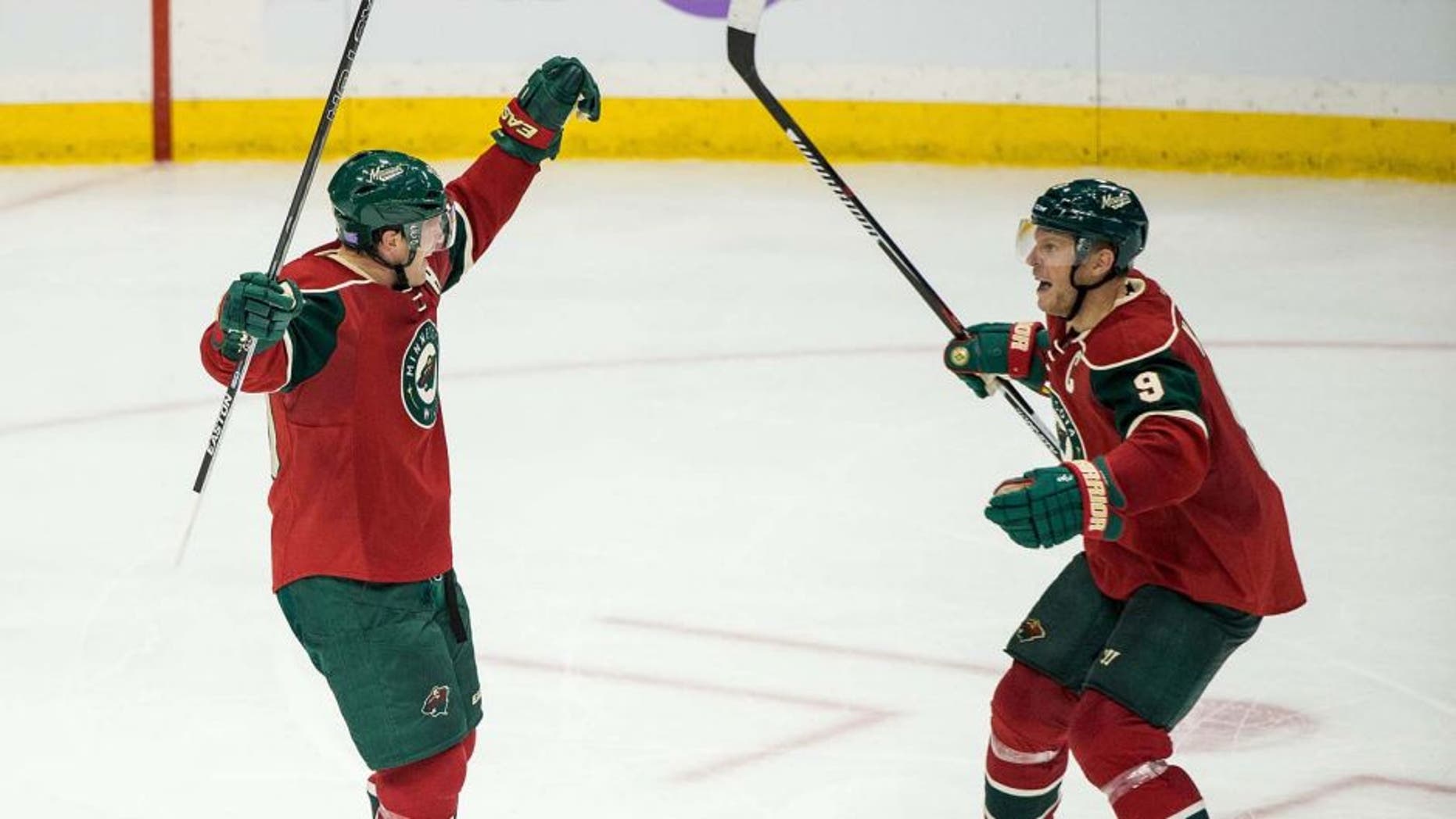 Minnesota Wild defenseman Ryan Suter (left) celebrates his goal with forward Mikko Koivu during the third period of the Wild's 4-3 win against the Edmonton Oilers at Xcel Energy Center on Tuesday, Oct. 27, 2015.
