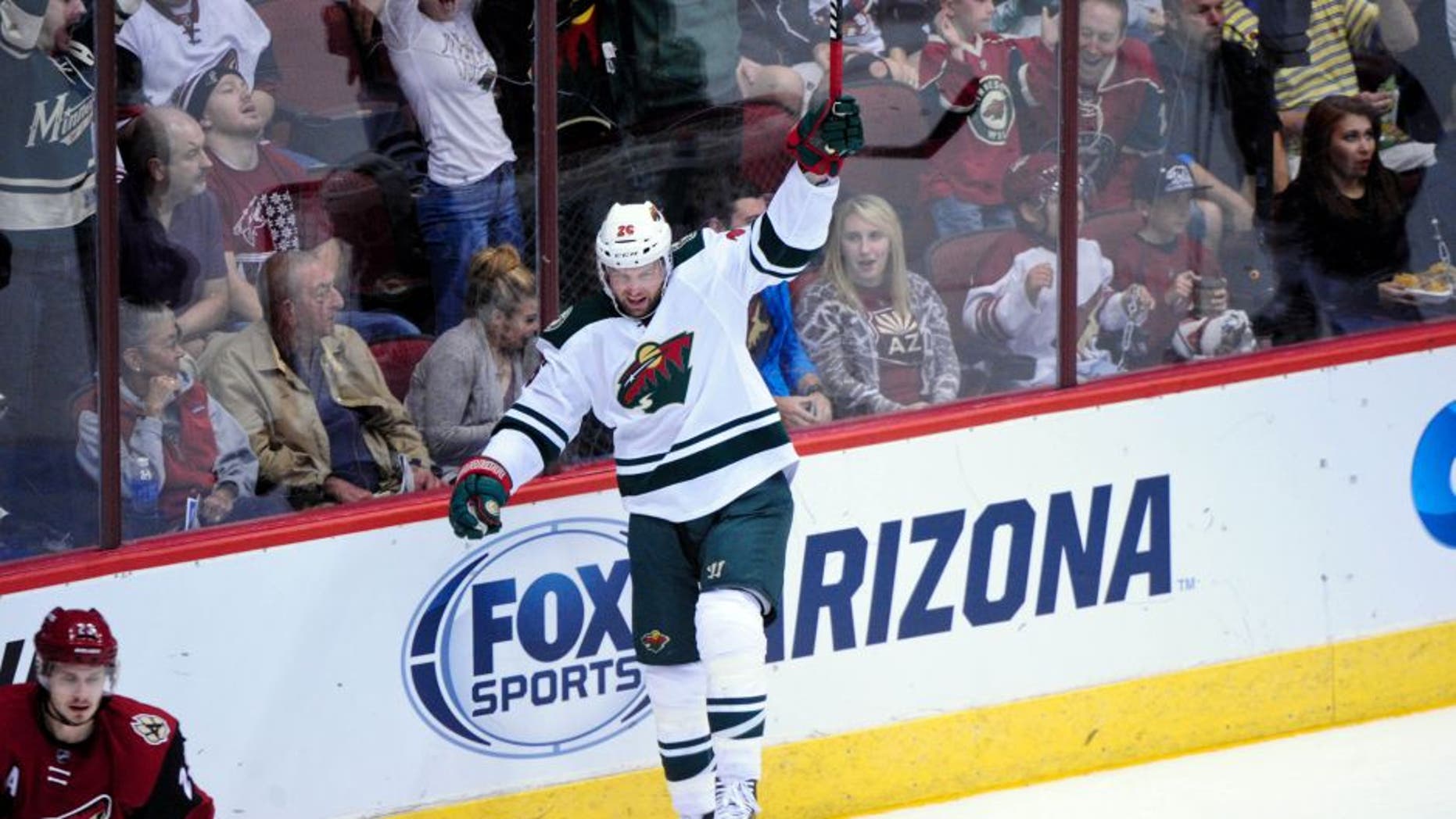 Oct 15, 2015; Glendale, AZ, USA; Minnesota Wild left wing Thomas Vanek (26) celebrates after scoring a goal in the first period against the Arizona Coyotes at Gila River Arena. Mandatory Credit: Matt Kartozian-USA TODAY Sports
