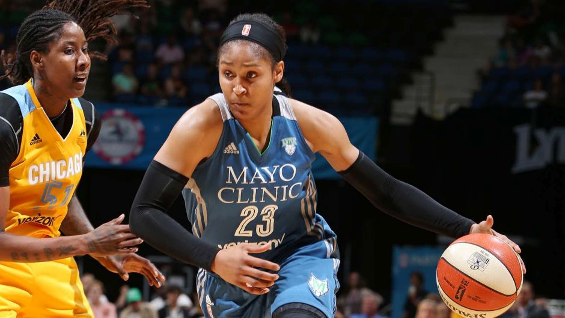 MINNEAPOLIS, MN - JULY 5: Maya Moore #23 of the Minnesota Lynx drives to the basket against Jessica Breland #51 of the Chicago Sky on July 5, 2016 at Target Center in Minneapolis, Minnesota. NOTE TO USER: User expressly acknowledges and agrees that, by downloading and or using this Photograph, user is consenting to the terms and conditions of the Getty Images License Agreement. Mandatory Copyright Notice: Copyright 2016 NBAE (Photo by David Sherman/NBAE via Getty Images)