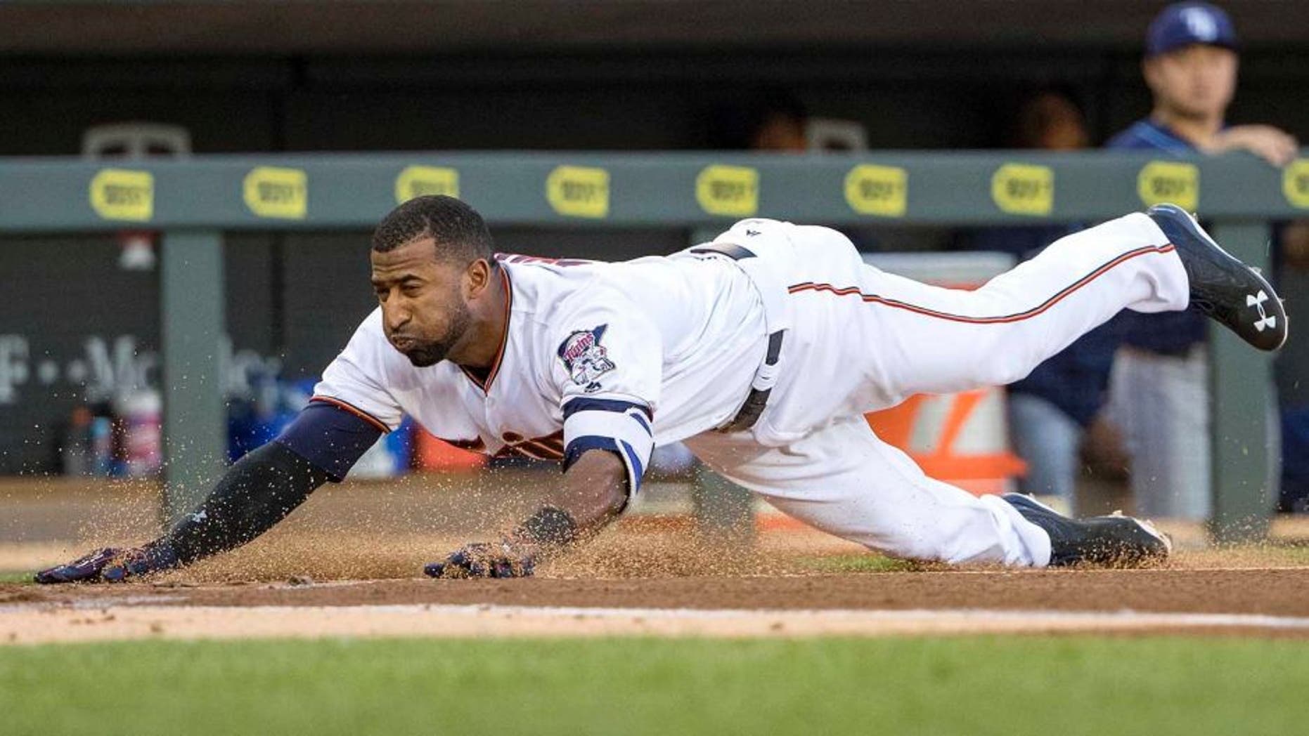 Jun 2, 2016; Minneapolis, MN, USA; Minnesota Twins shortstop Eduardo Nunez (9) slides into home plate safely for an inside the park home run in the first inning against the Tampa Bay Rays at Target Field. Mandatory Credit: Jesse Johnson-USA TODAY Sports