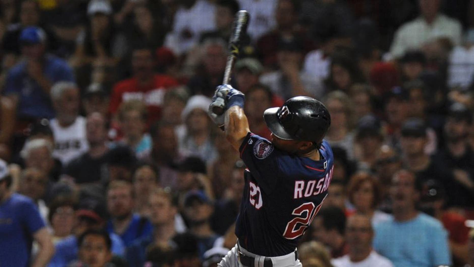 Jul 23, 2016; Boston, MA, USA; Minnesota Twins left fielder Eddie Rosario (20) hits an RBI single during the seventh inning against the Boston Red Sox at Fenway Park. Mandatory Credit: Bob DeChiara-USA TODAY Sports