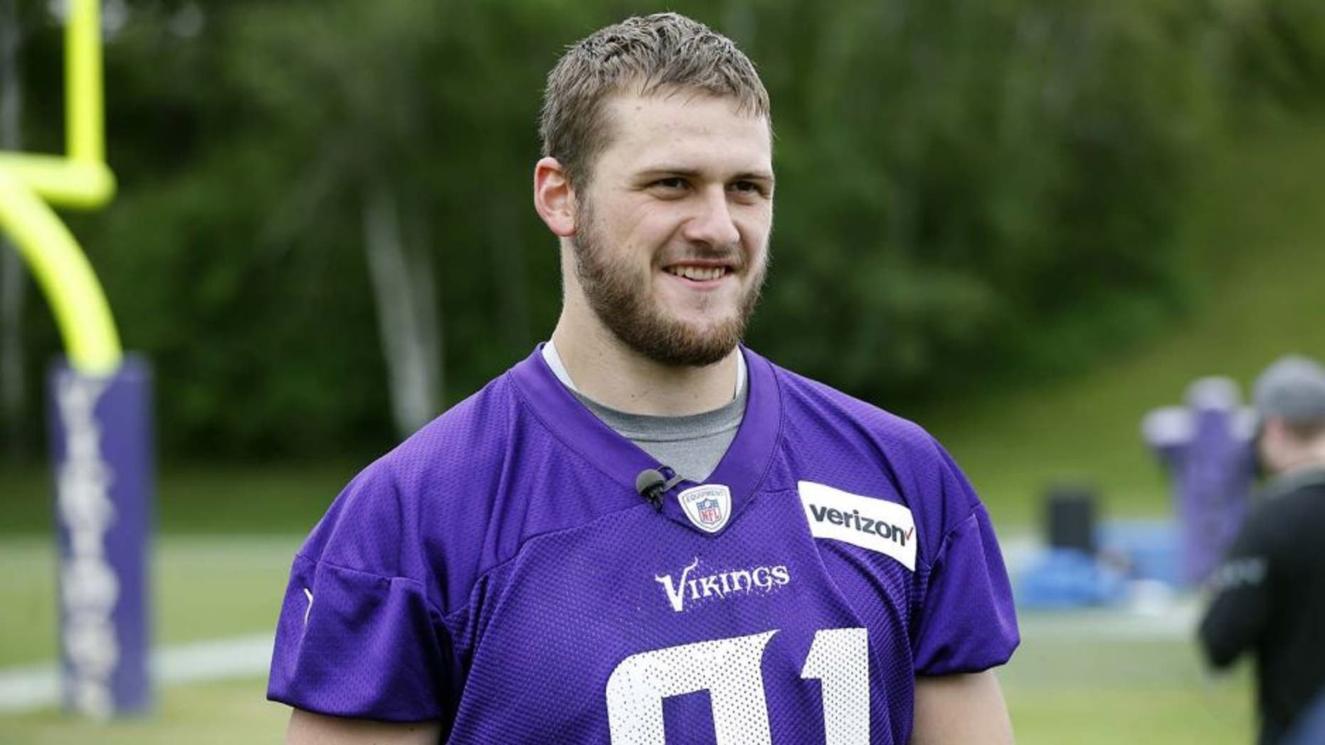 FILE - In this June 1, 2016, file photo, Minnesota Vikings wide receiver Moritz Boehringer, of Germany, is interviewed after practice in Eden Prairie, Minn. Boehringer's size and speed captured the attention of the Vikings, who took a chance on a raw wide receiver in the sixth round of the draft. (AP Photo/Jim Mone, File)