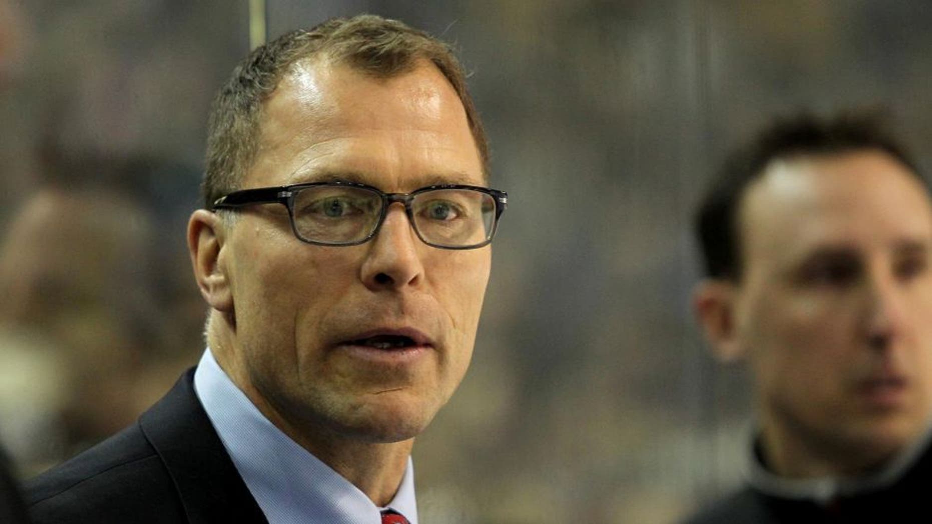 Mar. 2, 2013; Buffalo, NY, USA; New Jersey Devils assistant coach Scott Stevens on the bench against the Buffalo Sabres at First Niagara Center. Mandatory Credit: Timothy T. Ludwig-USA TODAY Sports