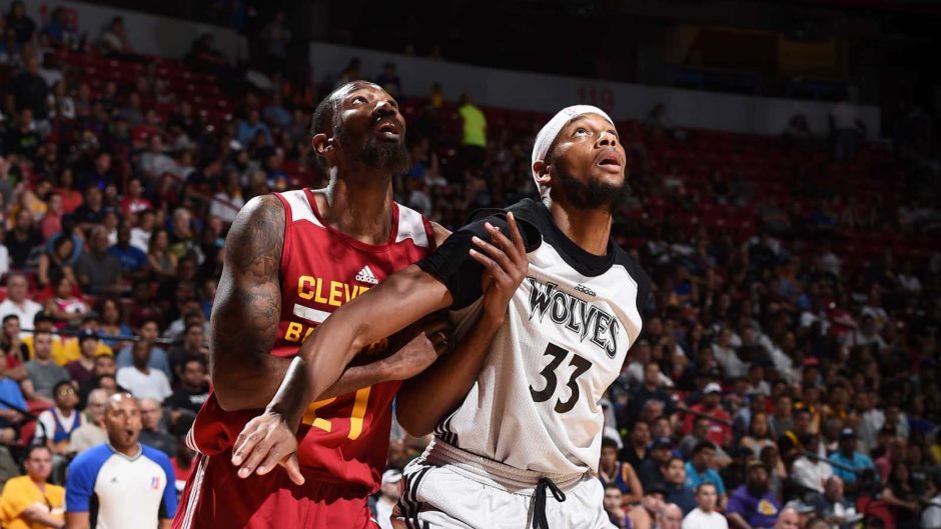 LAS VEGAS, NV - JULY 11: Cory Jefferson #21 of the Cleveland Cavaliers fights for position against Adreian Payne #33 of the Minnesota Timberwolves during the 2016 NBA Las Vegas Summer League on July 11, 2016 at The Thomas & Mack Center in Las Vegas, Nevada. NOTE TO USER: User expressly acknowledges and agrees that, by downloading and or using this photograph, user is consenting to the terms and conditions of Getty Images License Agreement. Mandatory Copyright Notice: Copyright 2016 NBAE (Photo by Garrett Ellwood/NBAE via Getty Images)
