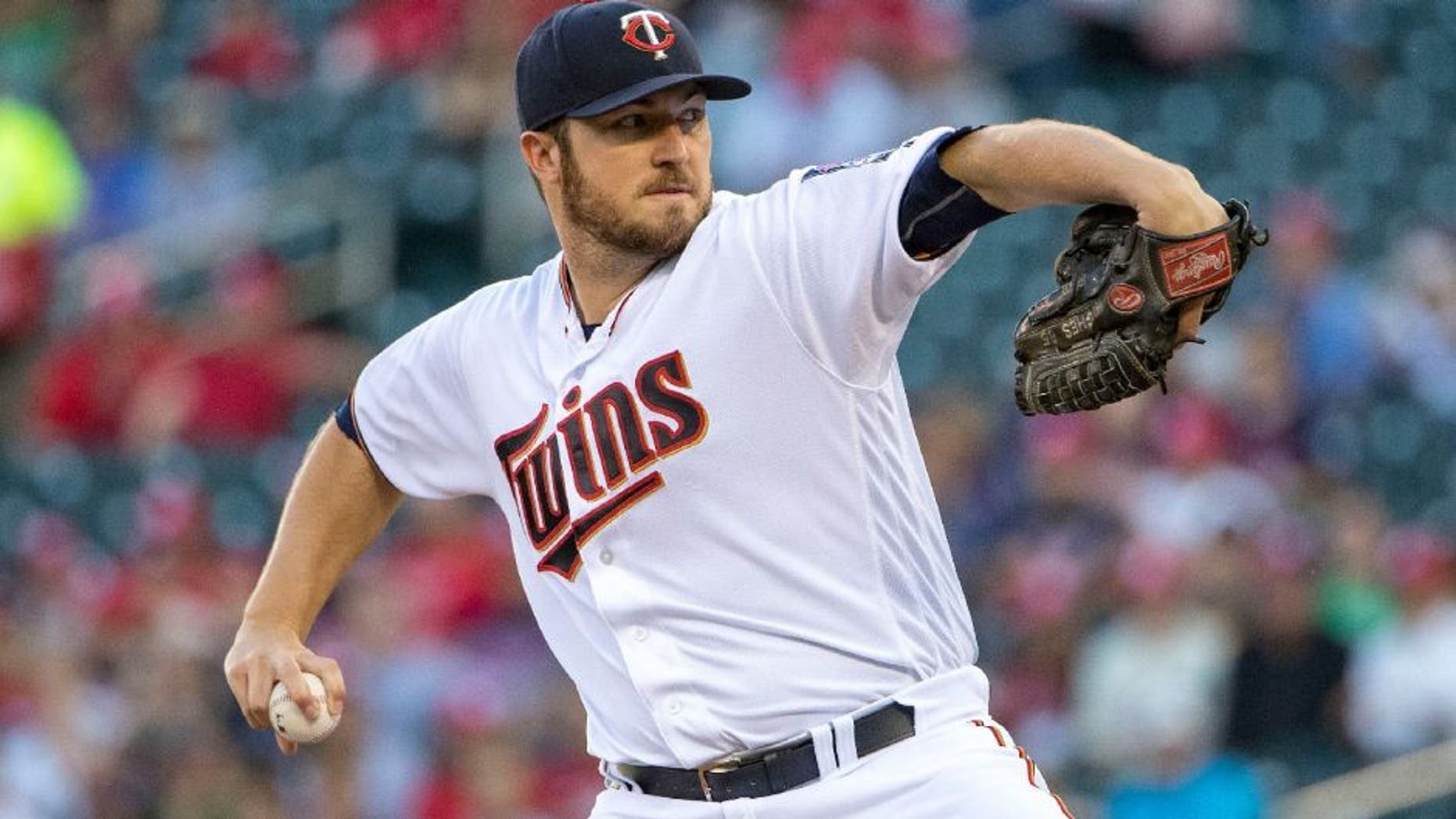 Minnesota Twins starting pitcher Phil Hughes delivers a pitch in the first inning against the Tampa Bay Rays.