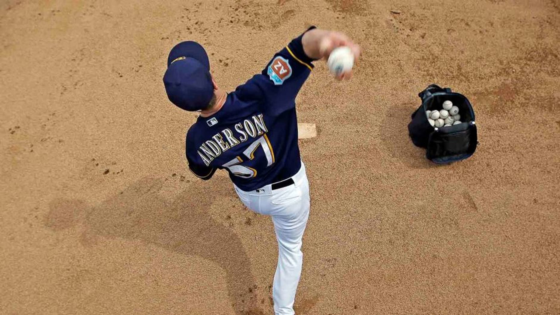 Milwaukee Brewers' Chase Anderson warms up before a inning of a spring training baseball game against the Chicago Cubs Thursday, March 3, 2016, in Phoenix. (AP Photo/Morry Gash)