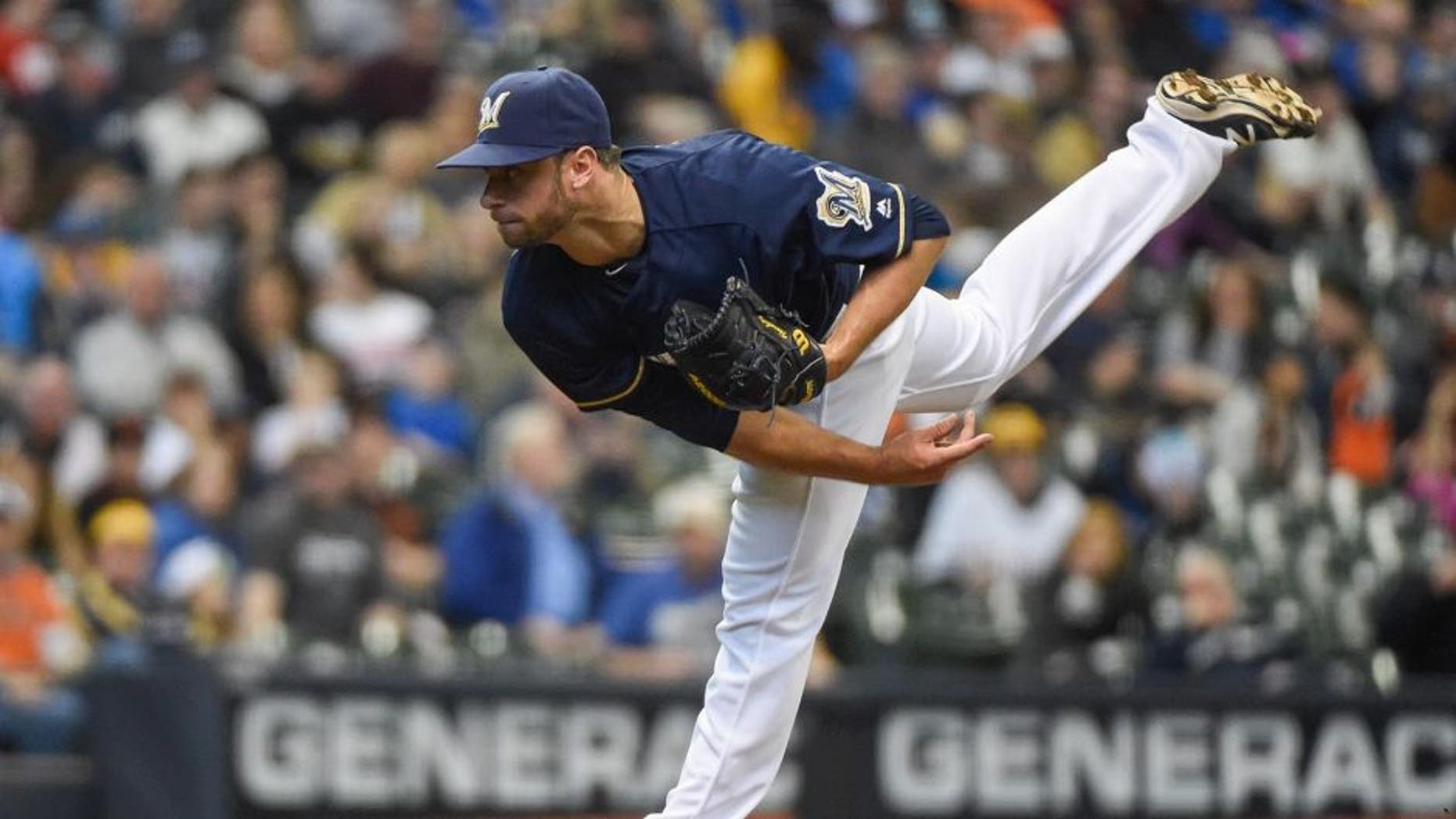 Apr 6, 2016; Milwaukee, WI, USA; Milwaukee Brewers pitcher Tyler Thornburg (37) pitched an inning of scoreless relief against the San Francisco Giants at Miller Park. Thornburg picked up the win as the Brewers beat the Giants 4-3. Mandatory Credit: Benny Sieu-USA TODAY Sports