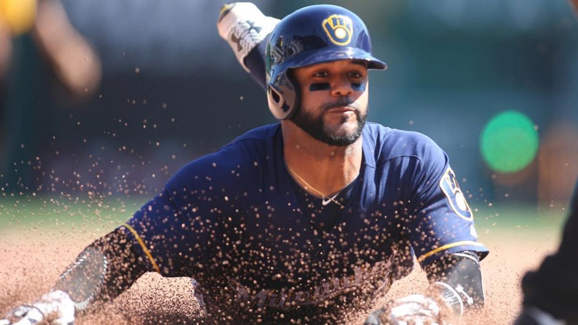 Apr 17, 2016; Pittsburgh, PA, USA; Milwaukee Brewers shortstop Jonathan Villar (5) slides into third base on a steal attempt against the Pittsburgh Pirates during the fifth inning at PNC Park. Mandatory Credit: Charles LeClaire-USA TODAY Sports