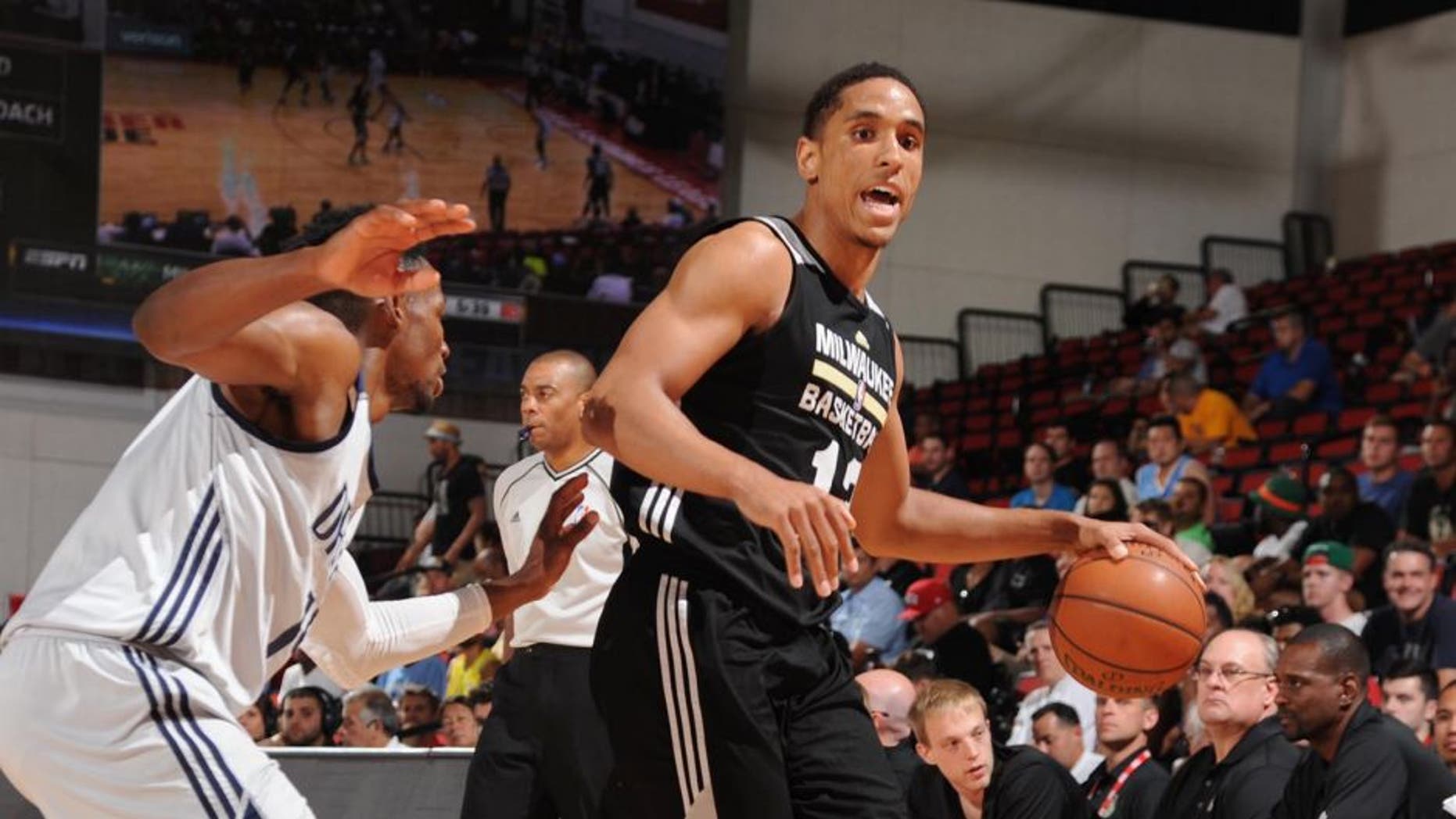 LAS VEGAS, NV - JULY 13: Malcolm Brogdon #13 of Milwaukee Bucks defends the ball against the Dallas Mavericks during the 2016 Las Vegas Summer League on July 13, 2016 at the Cox Pavillon in Las Vegas, Nevada. NOTE TO USER: User expressly acknowledges and agrees that, by downloading and or using this Photograph, user is consenting to the terms and conditions of the Getty Images License Agreement. Mandatory Copyright Notice: Copyright 2016 NBAE (Photo by Bart Young/NBAE via Getty Images)