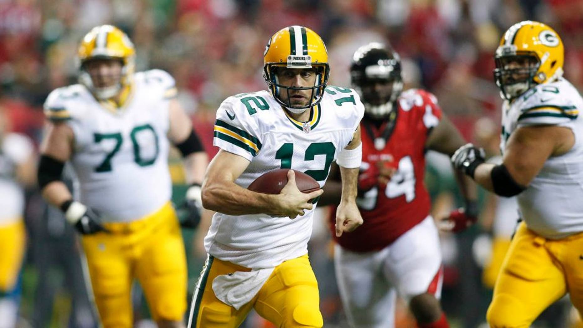 Oct 30, 2016; Atlanta, GA, USA; Green Bay Packers quarterback Aaron Rodgers (12) runs the ball against the Atlanta Falcons in the second quarter at the Georgia Dome. Mandatory Credit: Brett Davis-USA TODAY Sports