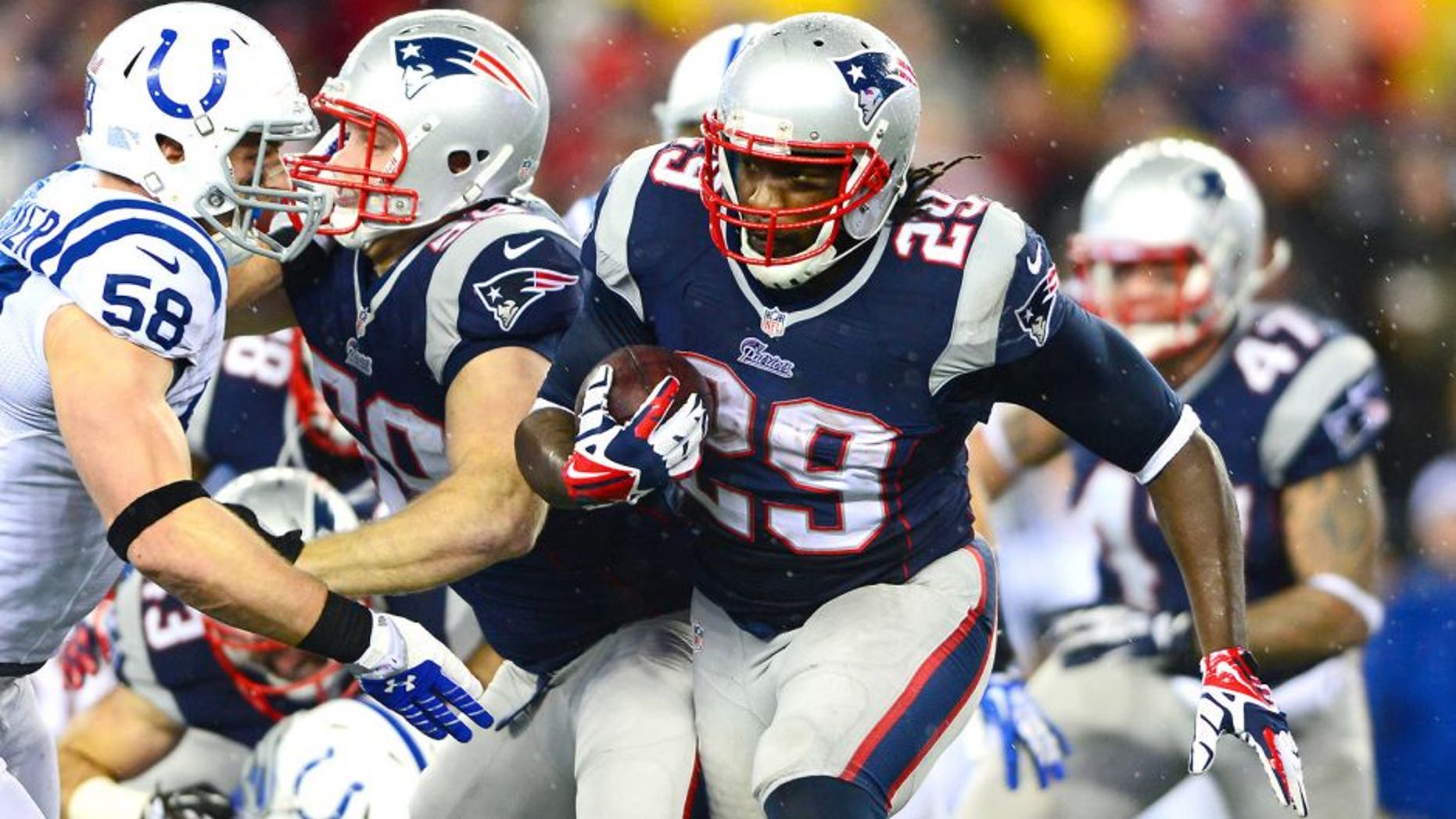 Jan 11, 2014; Foxborough, MA, USA; New England Patriots running back LeGarrette Blount (29) runs the ball during the second quarter of the 2013 AFC divisional playoff football game against the Indianapolis Colts at Gillette Stadium. Mandatory Credit: Andrew Weber-USA TODAY Sports