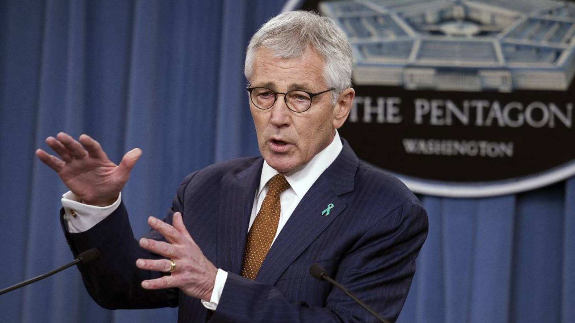 FILE - In this Dec. 4, 2014 file photo, Defense Secretary Chuck Hagel speaks at the Pentagon. The Pentagon took initial steps Friday to set up a new agency that will direct the troubled effort to search for America’s missing war dead, two years after an internal report found the current program was mismanaged and wasteful. (AP Photo/Cliff Owen, File)