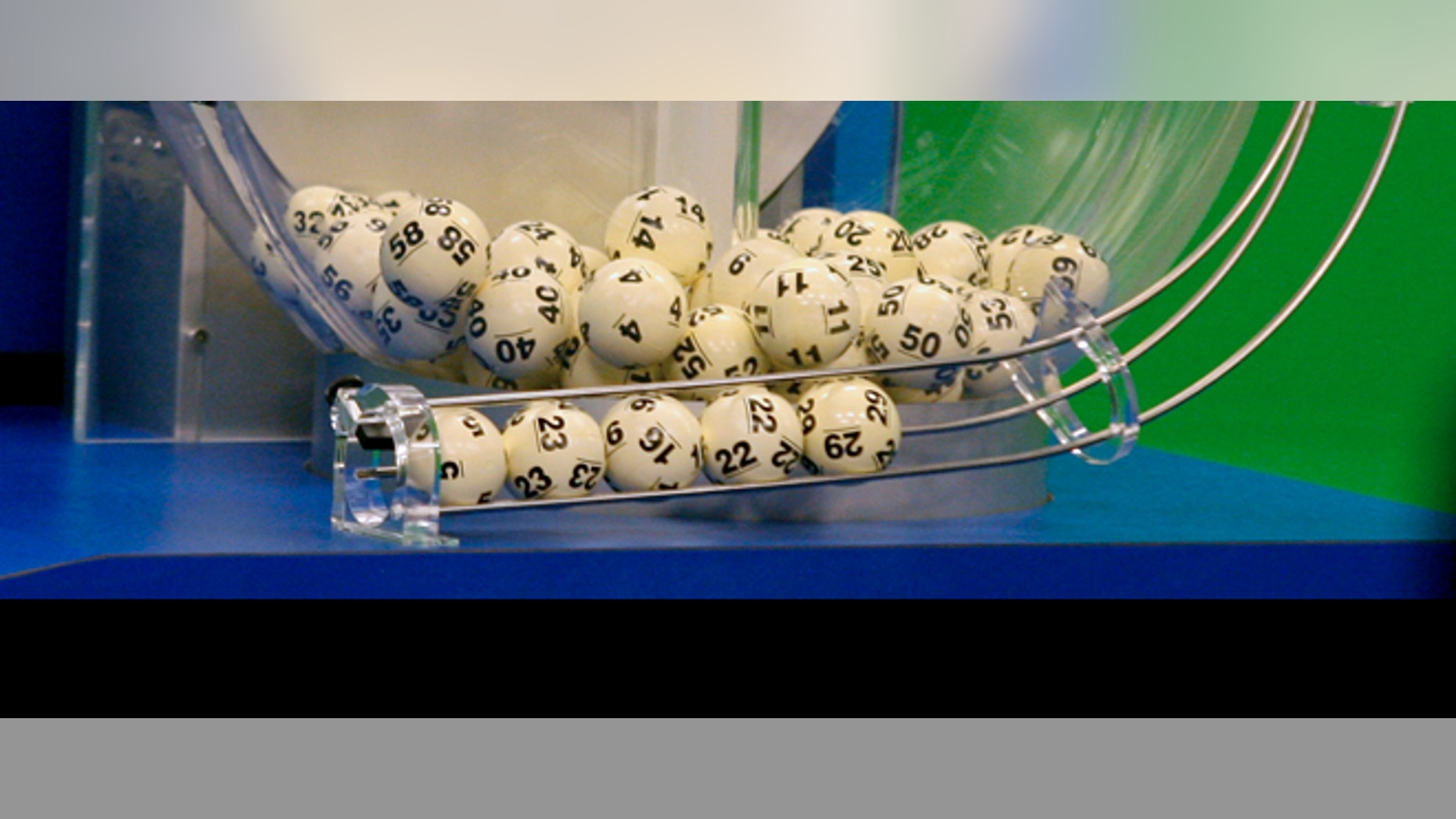 Powerball numbers are chosen in the drawing at the Florida Lottery on Wednesday, Nov. 28, 2012, in Tallahassee, Fla. The numbers drawn in the $579.9-million game were: 5, 16, 22, 23, 29 and Powerball of 6. (AP Photo/Phil Sears)