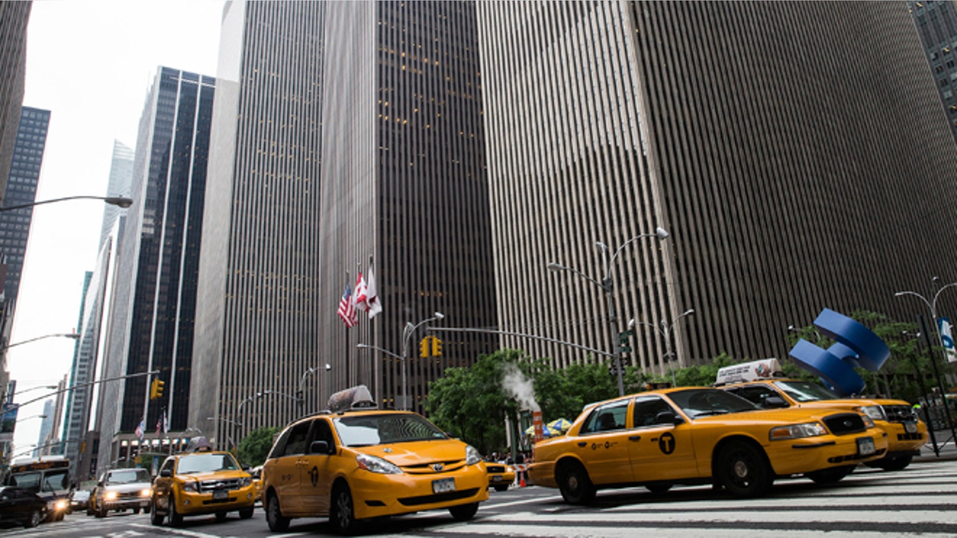 NEW YORK, NY - JUNE 18: Taxies drive down Sixth Avenue, also known as "Avenue of the Americas" on June 18, 2013 in New York City. The prices for office space along sixth avenue, typically famous for being some of the most expensive real estate in New York, have been falling recently. (Photo by Andrew Burton/Getty Images)