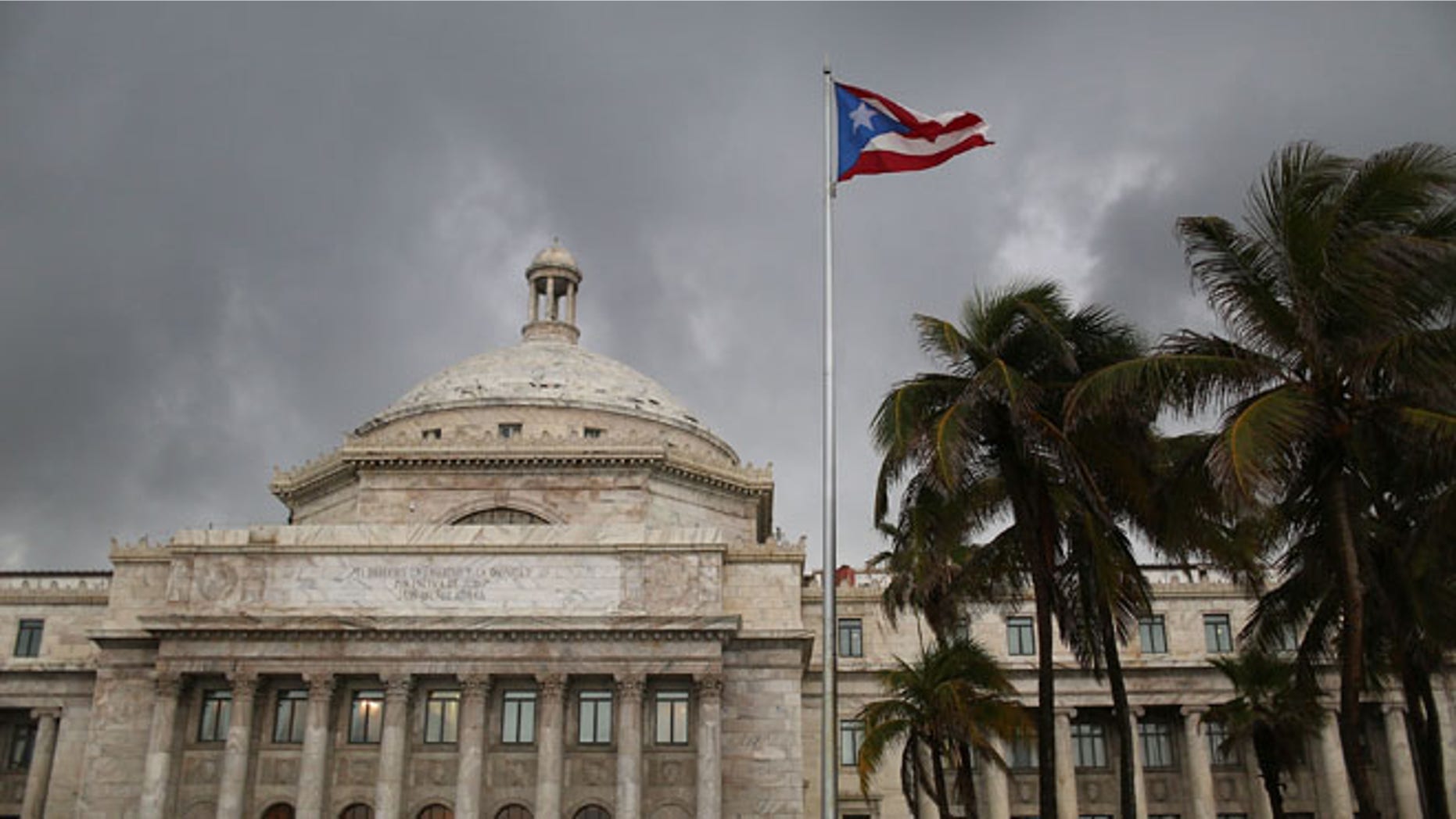 The Puerto Rican flag flies near the Capitol building. (Photo by Joe Raedle/Getty Images)