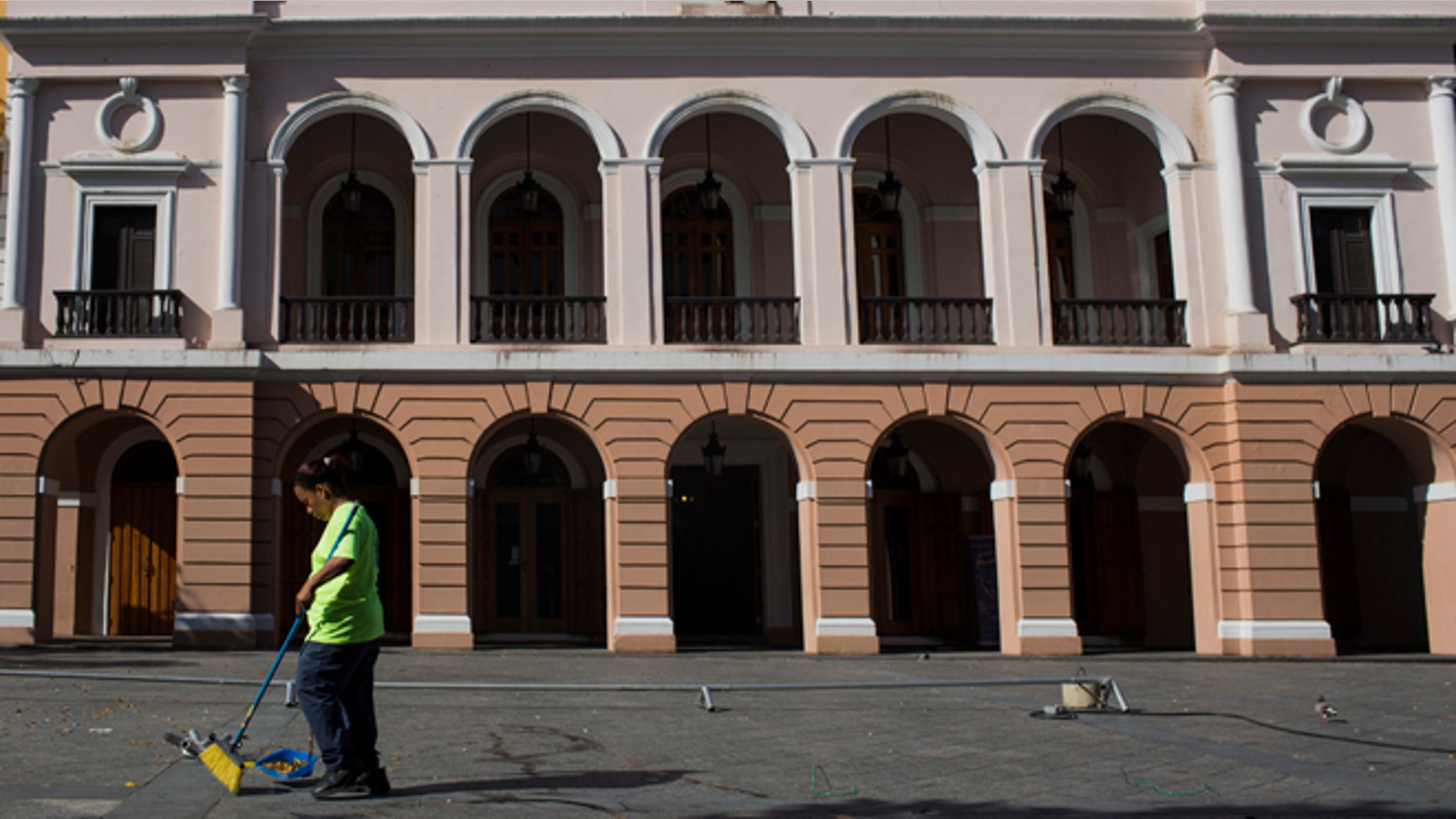 A worker sweeps up litter in San Juan, Puerto Rico.