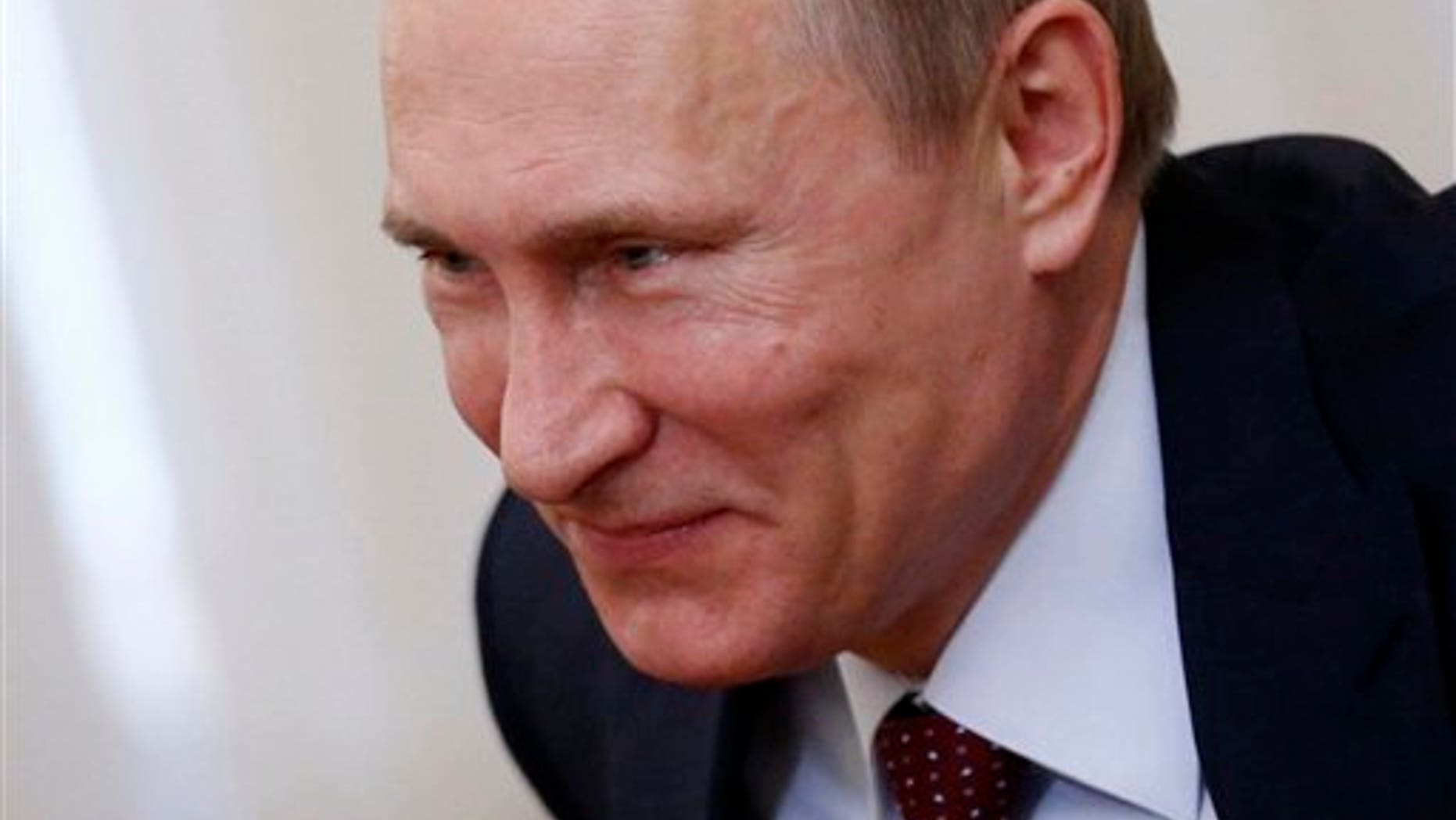 Russian President Vladimir Putin meets with Royal Dutch Shell's CEO Ben Van Beurden in the Novo-Ogaryovo residence outside Moscow, Russia, Friday, April 18, 2014. (AP Photo/Maxim Shipenkov, Pool)