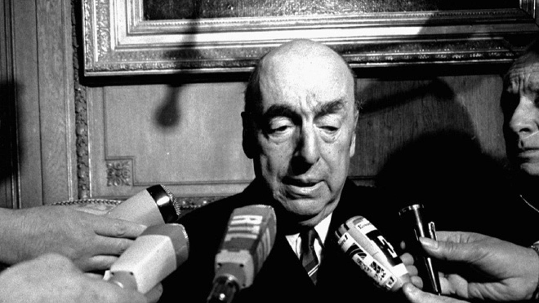 FILE - This Oct. 21, 1971 file photo shows Pablo Neruda, poet and then Chilean ambassador to France, talk with reporters in Paris after being named the 1971 Nobel Prize for Literature. Chileâs government is acknowledging that Neruda might have been killed after the 1973 coup that brought Gen. Augusto Pinochet to power. The Chile's Interior Ministry released a statement Thursday, Nov. 5, 2015, amid press reports that Neruda might not have died of cancer . (AP Photo/Laurent Rebours, File)