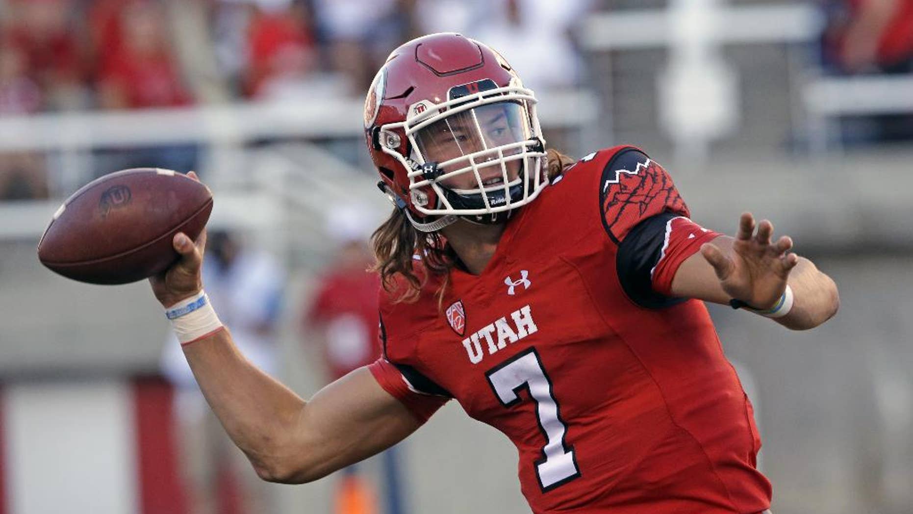 FILE - In this Aug. 28, 2014, file photo, Utah's Travis Wilson (7) throws the ball in the second quarter during an NCAA college football game against Idaho State in Salt Lake City. Wilson has thrown for 618 yards and has seven touchdowns with no interceptions as he leads the undefeated Utes (3-0) into Saturday's game against Washington State. (AP Photo/Rick Bowmer, File)