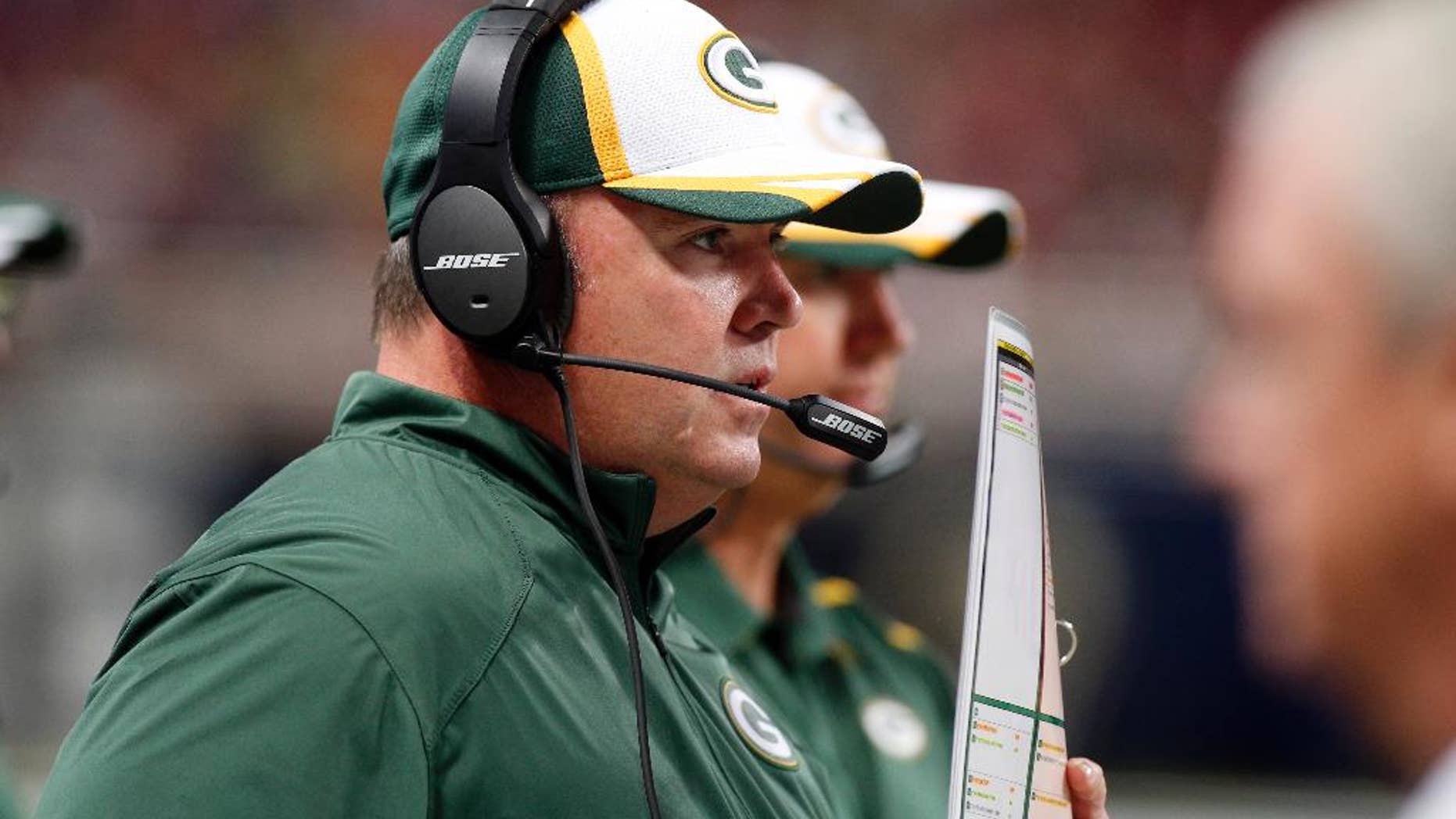 FILE - In this Aug. 16, 2014, file photo, Green Bay Packers head coach Mike McCarthy watches from the sidelines during the first quarter of an NFL preseason football game against the St. Louis Rams in St. Louis. The injury bug has hit the Packers again with two starters going down, but coach McCarthy has vowed to move forward.(AP Photo/Scott Kane, File)