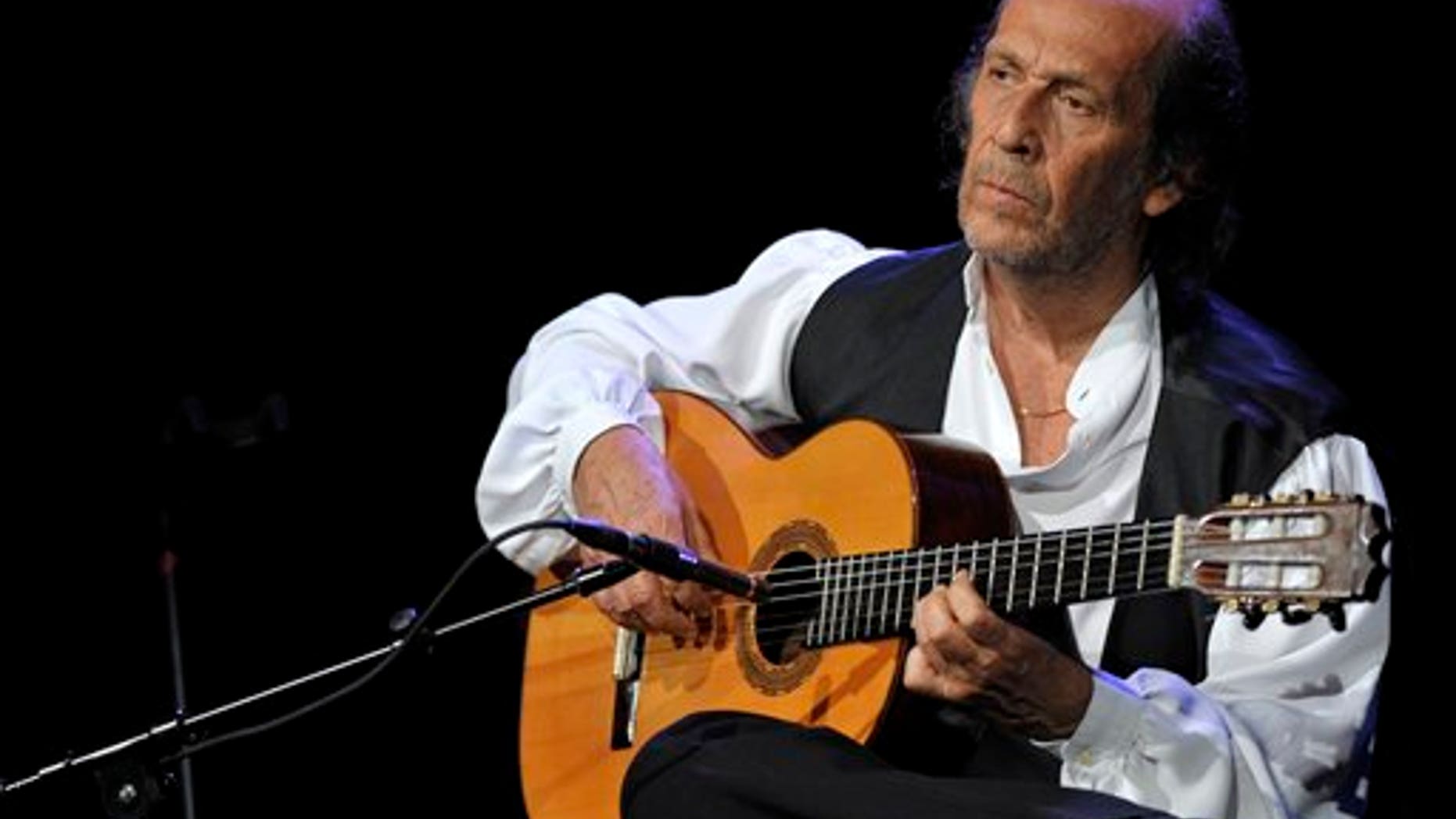FILE - In this July 8, 2010 file photo, Spanish flamenco guitarist Paco de Lucia performs on the Miles Davis Hall stage at the 44th Montreux Jazz Festival, in Montreux, Switzerland. Spanish officials said Wednesday Feb. 26, 2014 that world-renowned flamenco guitarist Paco de Lucia has died. He was 66. Jose Ignacio Landaluce, mayor of de Lucia's native Spanish town of Algeciras said in a statement Wednesday the guitarist died in Mexico, where he lived.The cause of death was not immediately made known. De Lucia, whose real name was Francisco Sanchez Gomez, was recognized as one of the world's leading guitarists, dazzling audiences with his lightning-speed flamenco rhythms and finger work. (AP Photo/Keystone, Martial Trezzini, File)