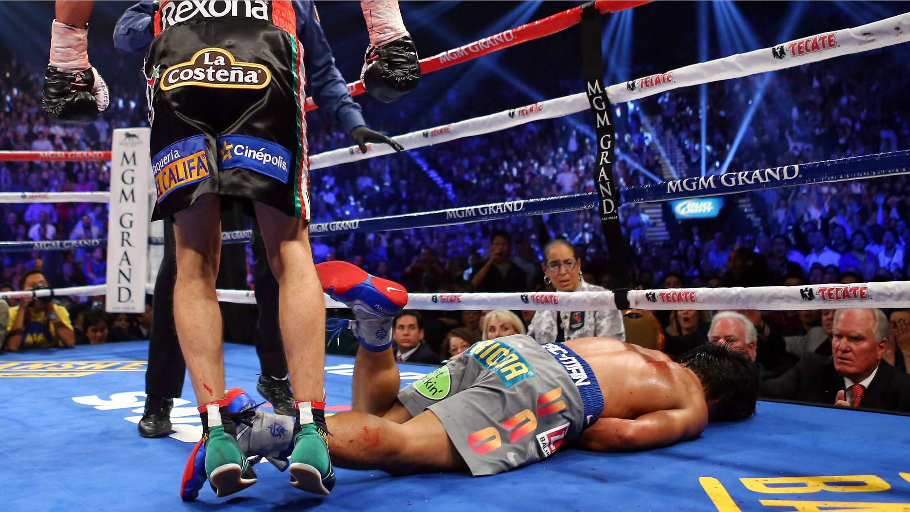 Manny Pacquiao lays face down on the mat after being knocked out in the sixth round by Juan Manuel Marquez during their welterweight bout at the MGM Grand Garden Arena on December 8, 2012 in Las Vegas, Nevada. (Photo by Al Bello/Getty Images)