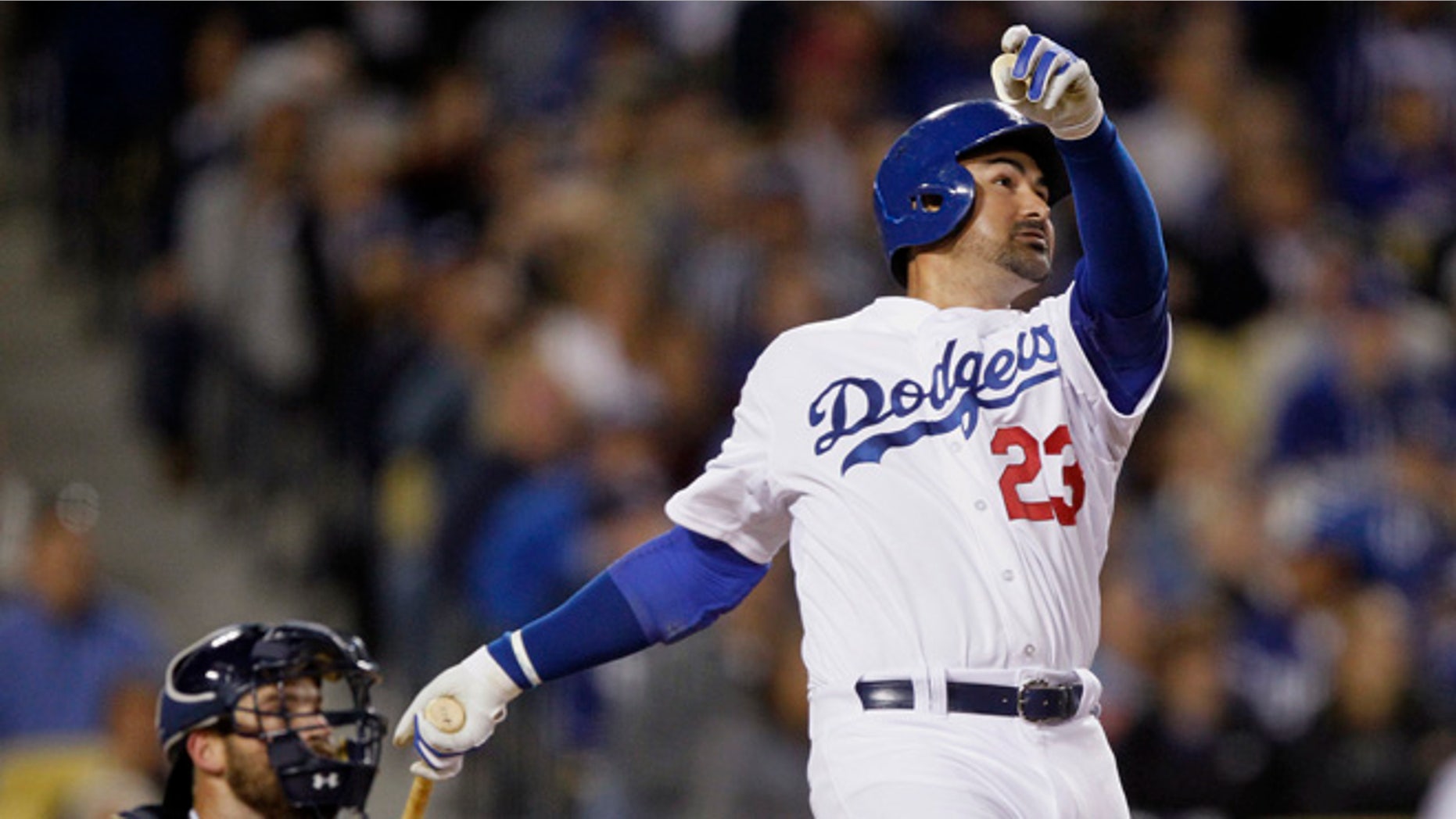 Los Angeles Dodgers' Adrian Gonzalez watches his solo home run in front of San Diego Padres catcher Derek Norris during the fifth inning of a baseball game in Los Angeles, Wednesday, April 8, 2015. It was Gonzalez's third homer of the night. (AP Photo/Alex Gallardo)